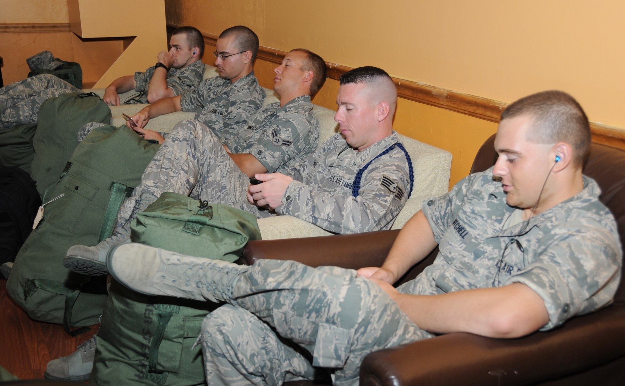 From left, Airman Christopher Roman, Airman Basic Keegan McCaskie, Airman 1st Class Noel Shaughnnessy, Staff Sgt. Brandon Eberhardt and Airman Basic Cory Mitchell shelter in Jones Hall.  Sergeant Eberhardt is a military training leader and the others are students in the 338th TRS.  (U.S. Air Force photo by Kemberly Groue)