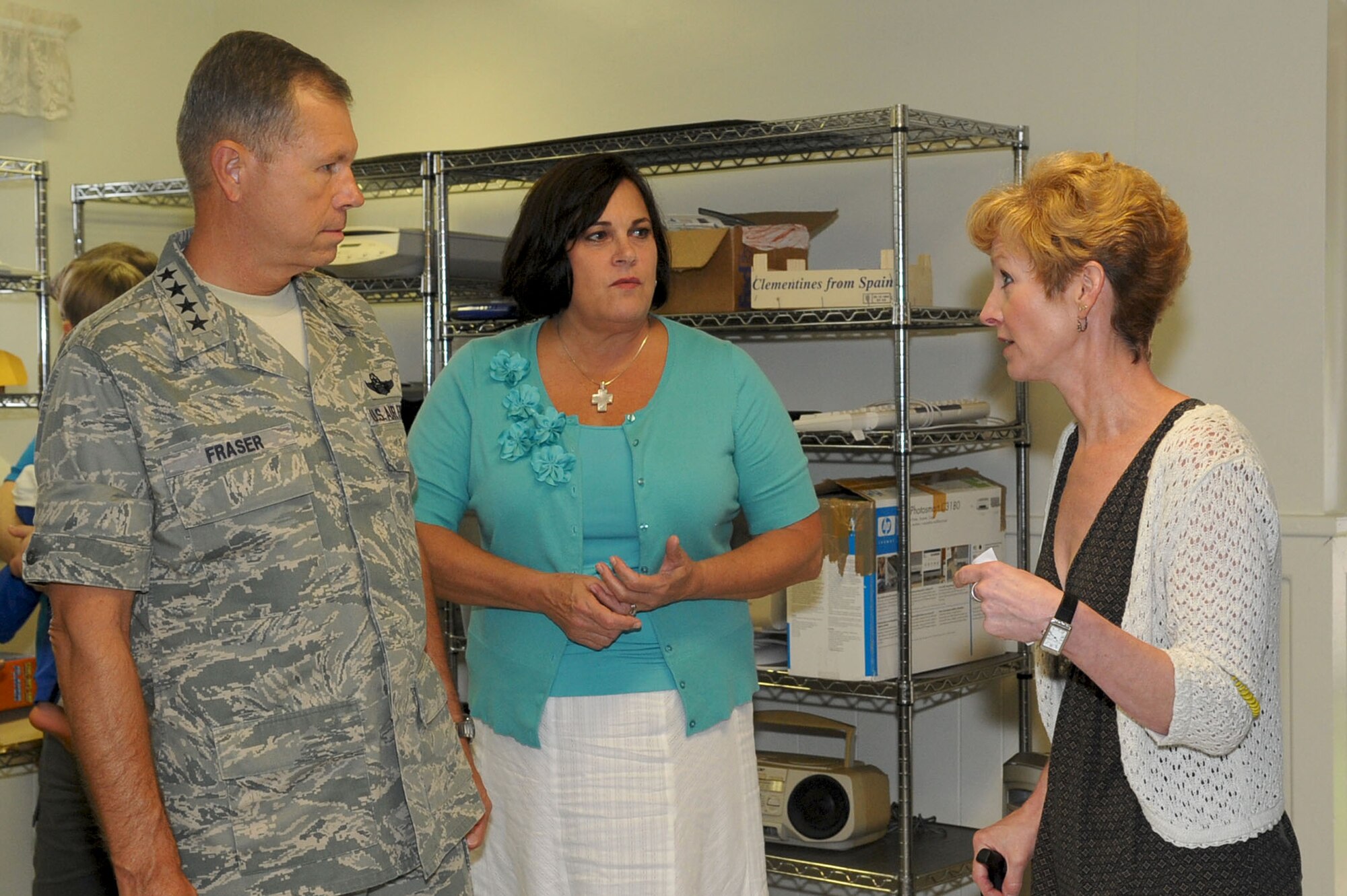 LANGLEY AIR FORCE BASE, Va. -- Sara Andreano (right), Langley Airman's Attic manager, briefs Gen. William M. Fraser III, commander of Air Combat Command, and his wife, Beverly, on the operations of the Airman's Attic during their base tour here, Aug. 24. (U.S. Air Force photo/Staff Sgt. Ashley Hawkins)