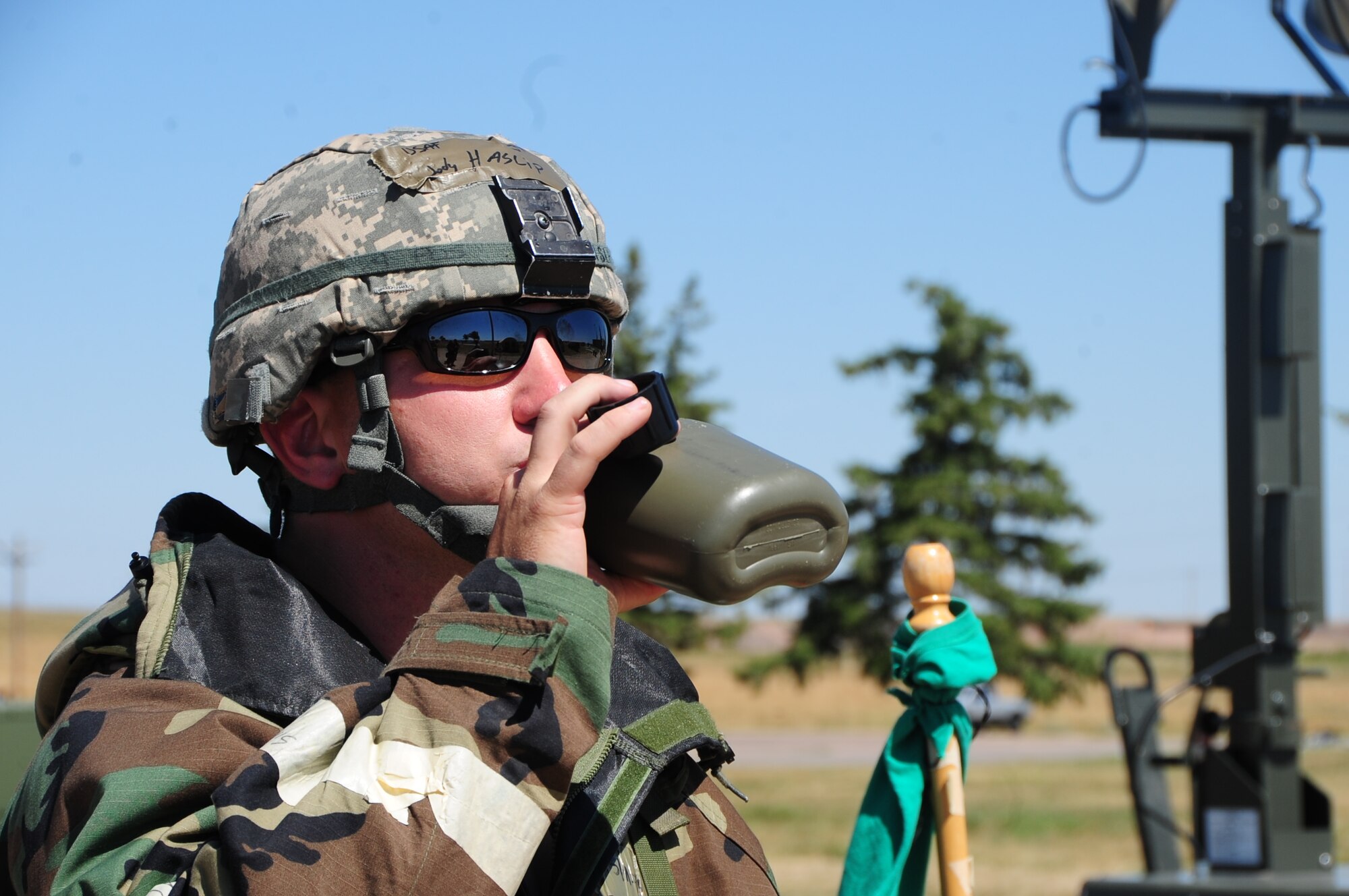 ELLSWORTH AIR FORCE BASE, S.D. -- Tech. Sgt. Jody Haslip, 28th Medical Support Squadron lab technician, drinks from his canteen during a phase II operational readiness exercise, Aug. 24.  Drinking water during the exercise will avoid getting dehydration or heat stroke. (U.S. Air Force photo/Airman 1st Class Anthony Sanchelli)