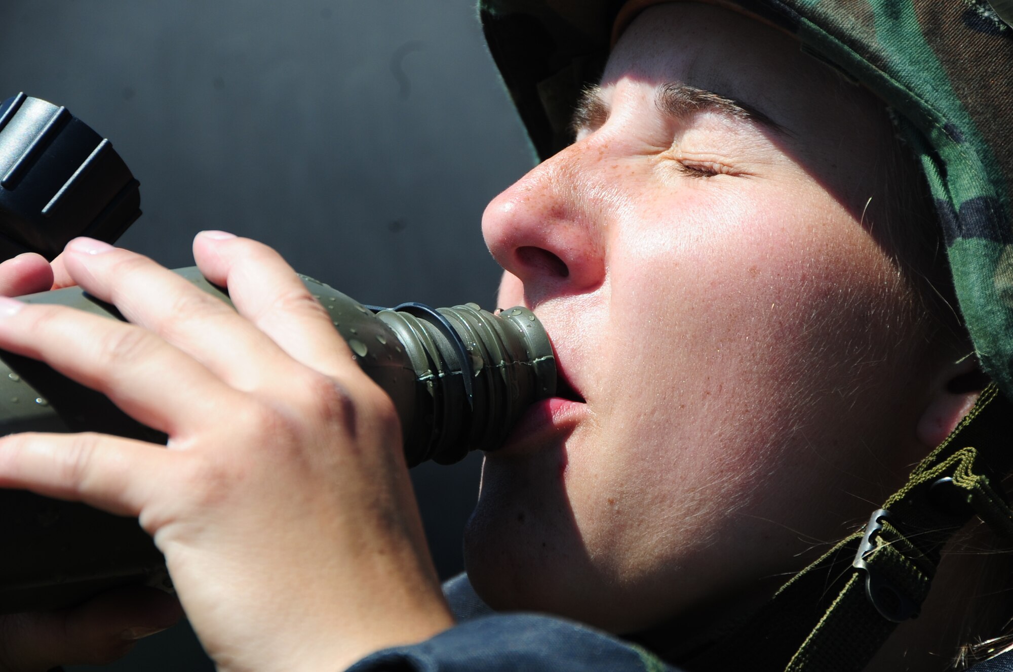 ELLSWORTH AIR FORCE BASE, S.D. -- Airman 1st Class Julie Kemps, 28th Medical Operations Squadron medical technician, drinks water from her canteen during a phase II operational readiness exercise, Aug. 24.  Drinking water during the exercise is crucial to staying hydrated. (U.S. Air Force photo/Airman 1st Class Anthony Sanchelli)