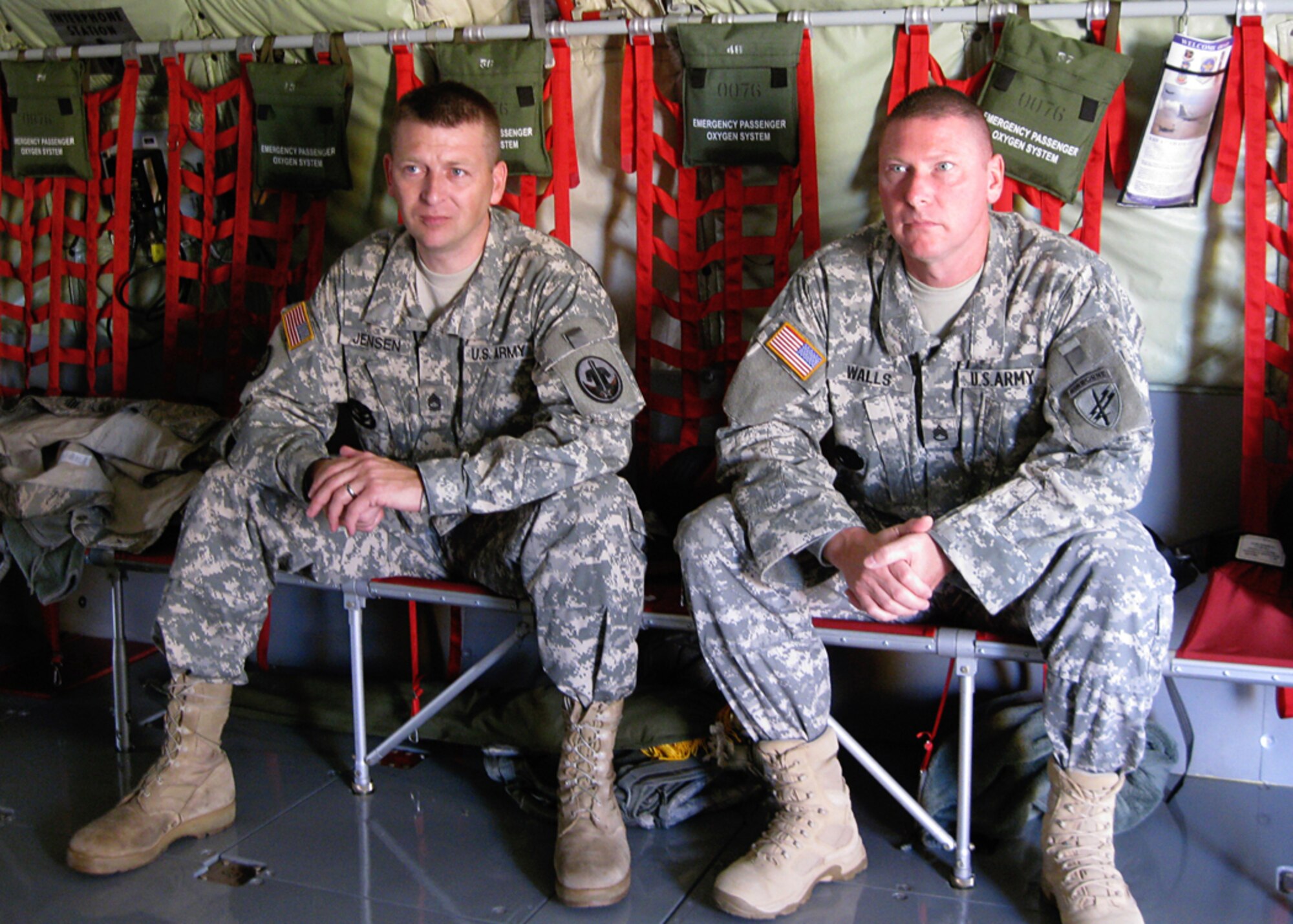GRISSOM AIR RESERVE BASE, Ind. -- Army Reserve Sgt. 1st Class Gary Jensen, left, and Staff Sgt. John Walls wait to take off Aug. 20 in a KC-135R Stratotanker from the Air Force Reserve's 434th Air Refueling Wing at Grissom Air Reserve Base, Ind. Sergeant Walls is a psychological operations specialist and Sergeant Jensen is a retention noncommissioned officer. Both Soldiers are assigned to the 316th Psychological Operations Company. Sergeant Walls reenlisted during the aerial refueling mission. (U.S. Army photo/ Staff Sgt. Tobe Hutchins)                       