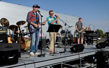 MINOT AIR FORCE BASE, N.D. -- The “Main Street Revival”, a band composed of Airmen from squadrons all across Minot AFB, perform an audience favorite at a base block party here Aug. 20. The block party was designed to increase unit readiness and morale. (U.S. Air Force photo by Senior Airman Benjamin Stratton)
