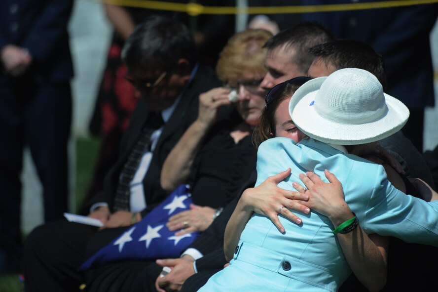 Melissa Sandberg, fiancé of Capt. David A. Wisniewski, is hugged by Deborah Mullen, wife of Navy Adm. Mike Mullen, chairman of the Joint Chiefs of Staff, during her fiancé's interment at Arlington National Cemetery Aug. 23, 2010.  Captain Wisniewski died July 2 from injuries suffered during a helicopter crash in Afghanistan. (U.S. Air Force photo/Staff Sgt. Gina Chiaverotti-Paige)
