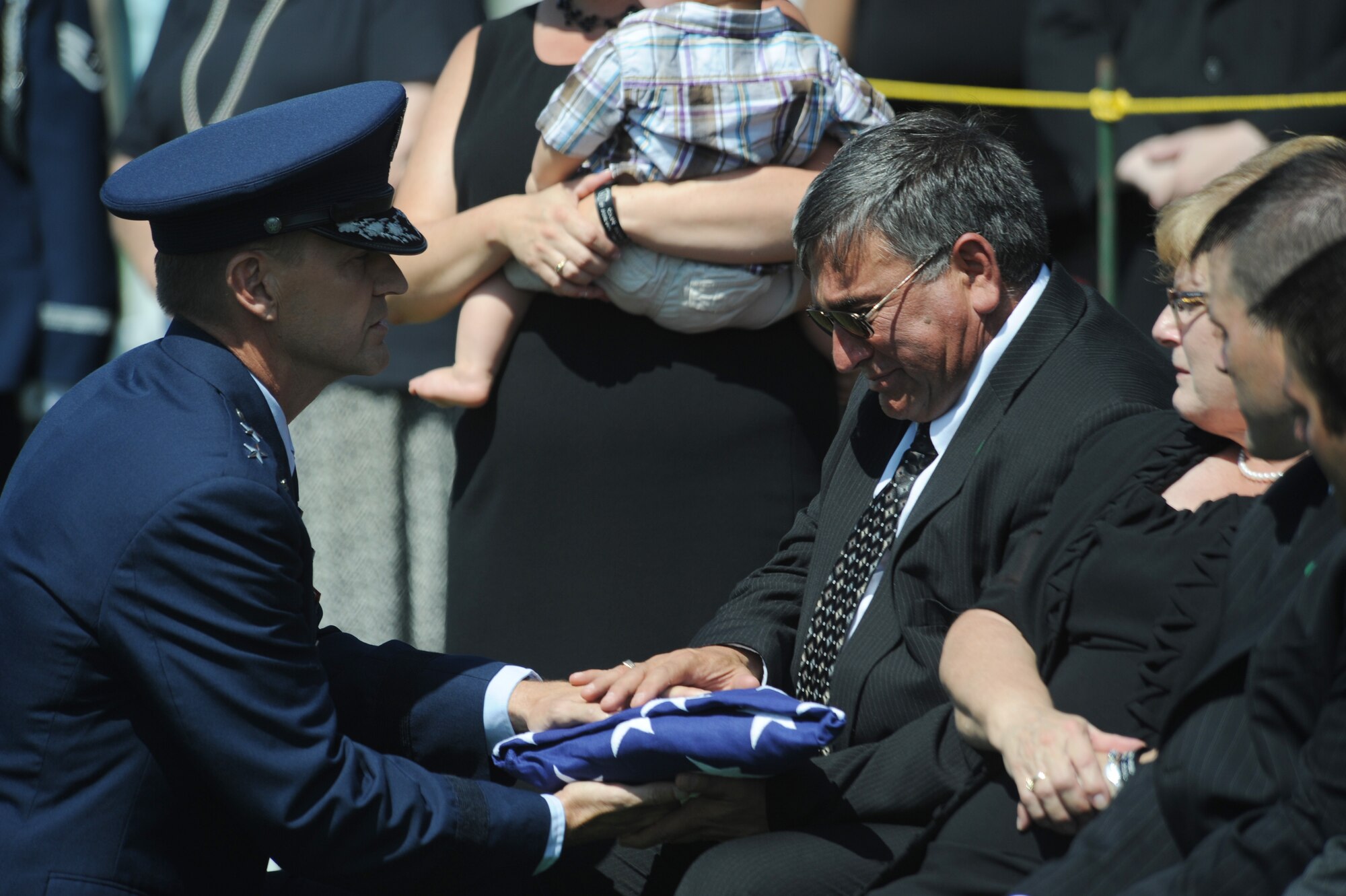 ARLINGTON, Va. -- Chet and Beverly Wisniewski receive the American flag that was draped over their son’s casket during his interment at Arlington National Cemetery Aug. 23. Captain David A. Wisniewski, who was a HH-60G Pave Hawk pilot out of the 66th Rescue Squadron at Nellis Air Force Base, Nev., died July 2, 2010, from injuries suffered during a helicopter crash in Afghanistan. (U.S. Air Force photo/Staff Sgt. Gina Chiaverotti-Paige)
