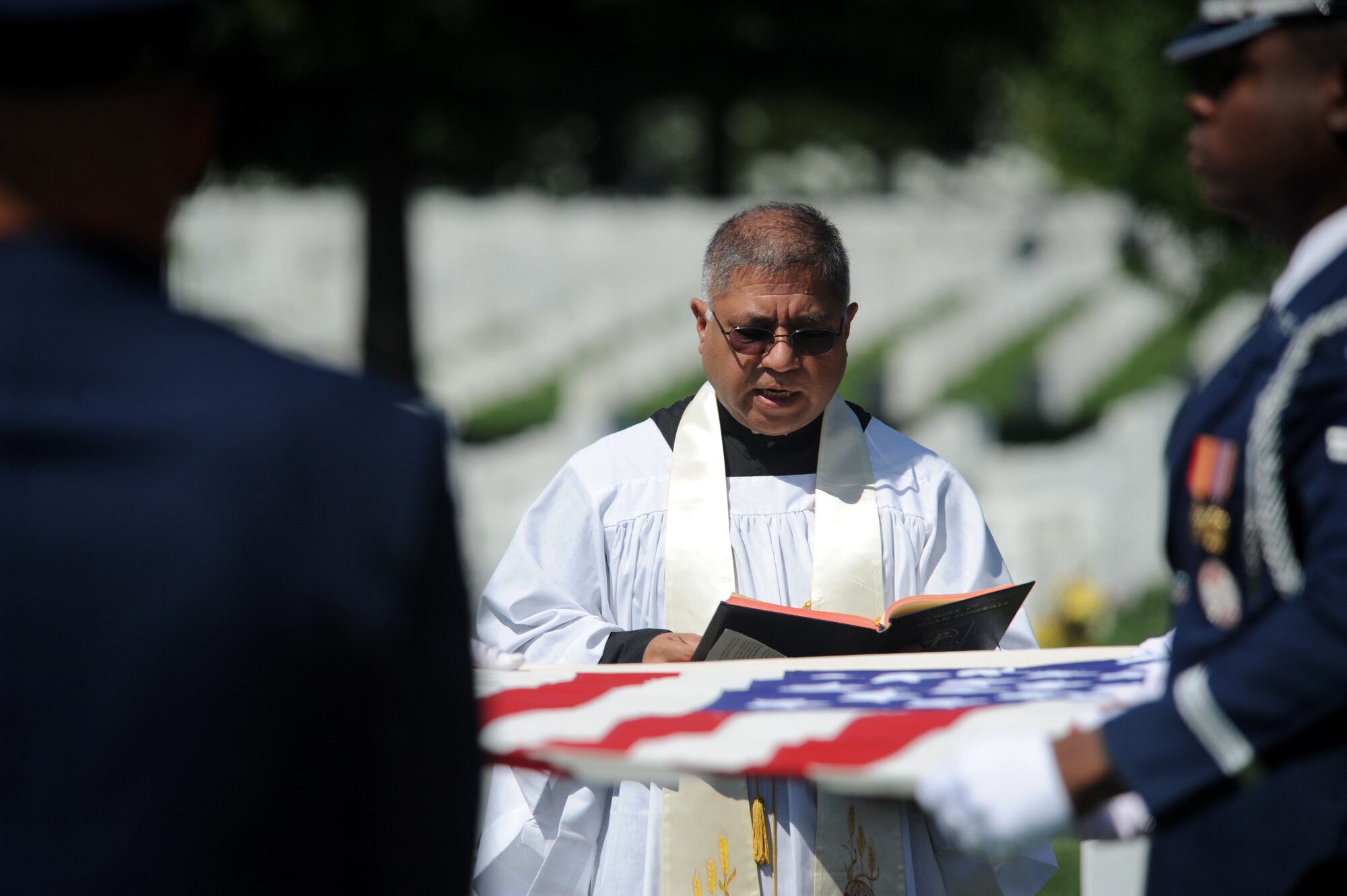 ARLINGTON, Va. -- Rev. Rudolph Juarez reads a scripture during Capt. David A. Wisniewski’s interment at Arlington National Cemetery Aug. 23. More than 100 military members were in attendance to honor the life and service of Captain Wisniewski. (U.S. Air Force photo/Staff Sgt. Gina Chiaverotti-Paige) 