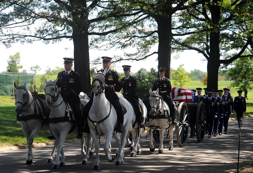 Members of the 3rd U.S. Infantry, traditionally known as "The Old Guard," transport Capt. David A. Wisniewski to his interment site Aug. 23, 2010, at Arlington National Cemetery, followed by Airmen from the U.S. Air Force Honor Guard. (U.S. Air Force photo/Staff Sgt. Gina Chiaverotti-Paige)