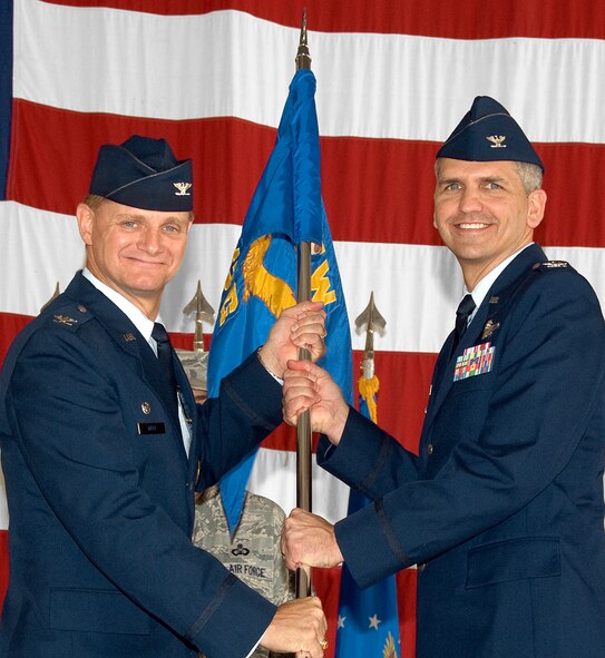 VANCE AIR FORCE BASE, Okla. -- Col. Kurt Meidel, right, accepts command of the 71st Operations Group from Col. Russ Mack, 71st Flying Training Wing commander, during a ceremony held Friday, Aug. 20, in Hangar 199. Colonel Meidel comes to Vance from the U.S. Transportation Command at Scott AFB, Ill. The Operations Group is directly responsible for graduating more than 425 new pilots every year. (U.S. Air Force photo/ Terry Wasson)