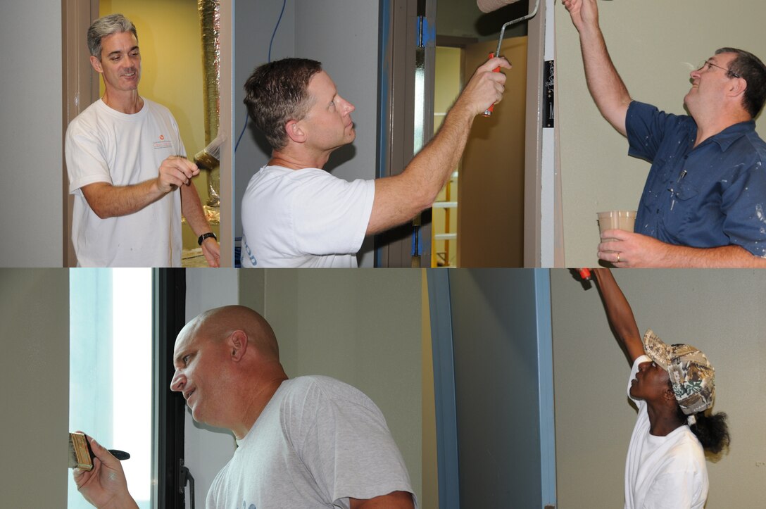 Members of the 165th AW Maintenance Group refurbish offices as a "Self-Help" project. MXG Commander Col. Jim Grandy and Maintenance Operations Flight Chief CMSgt Al Hammock grab brushes to help complete the project.