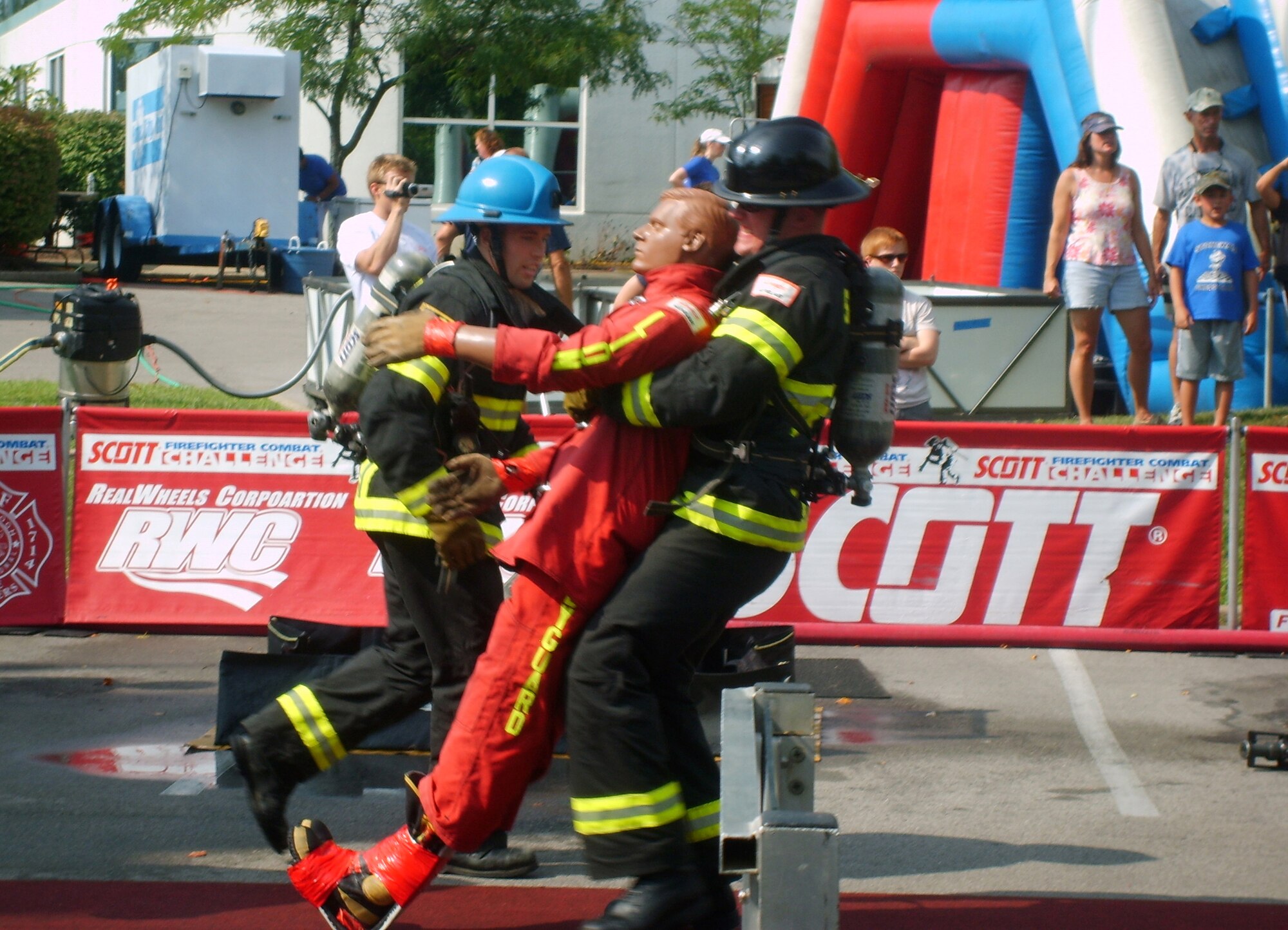 100812-F-0000T-001 Airman 1st Class Cody Nelson, 20th Civil Engineer Squadron firefighter, drags a 175 lb. dummy 100 feet backwards across the finish line during the third leg of the relay. (U.S. Air Force photo/Staff Sgt. Steven Thomas (Released)
