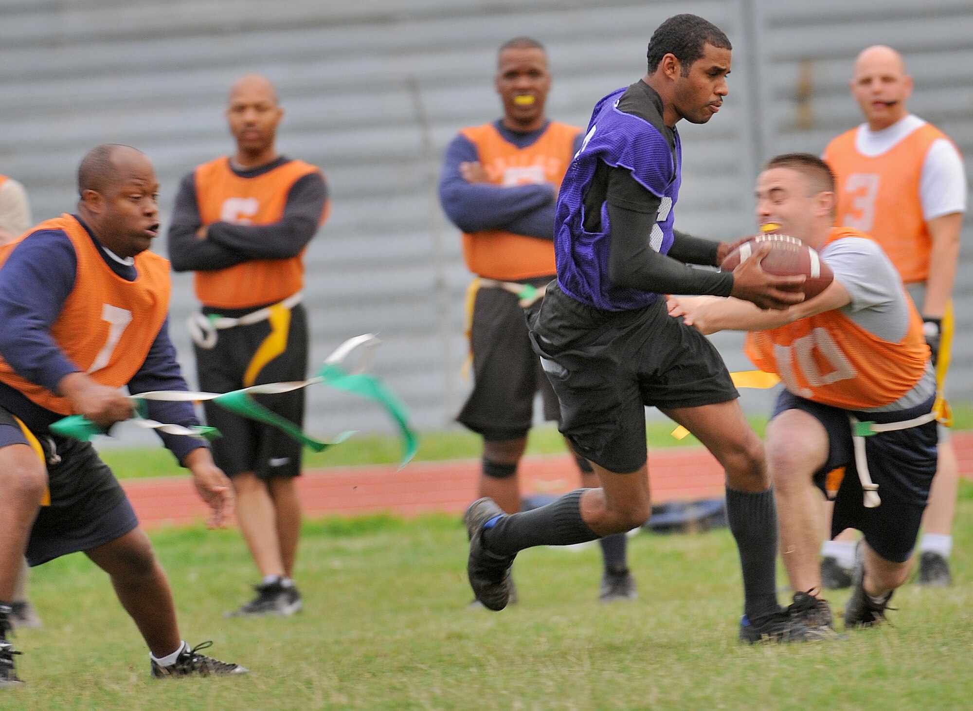 SPANGDAHLEM AIR BASE, Germany – William Jones, member of the combined 52nd Force Support Squadron/Maintenance Operation Squadron flag football team, runs for a gain of 10 yards during a flag football game Aug 17. The 52nd FSS/MOS defeated the 726th Air Mobility Squadron in overtime 14-13. (U.S. Air Force photo/Senior Airman Nick Wilson)