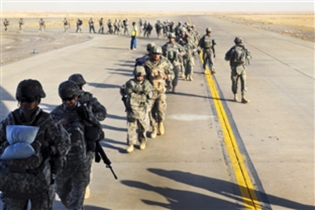 U.S. Army soldiers assigned to the 3rd Infantry Division board a C-17 scheduled to depart Contingency Operating Base Speicher, Iraq, Aug. 23, 2010. The soldiers front-loaded their bags to help smooth the process of boarding the aircraft.