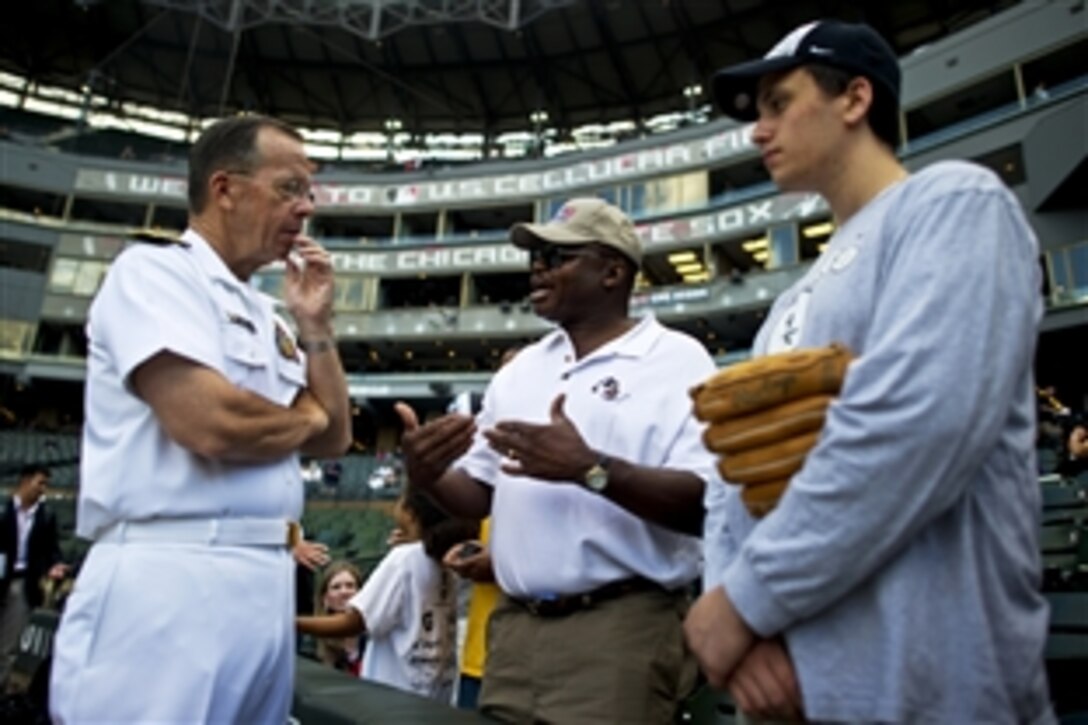 Navy Adm. Mike Mullen, chairman of the Joint Chiefs of Staff, visits with Chicago White Sox fans at U.S. Cellular Field in Chicago, Aug. 25, 2010. Mullen threw out the first pitch before the White Sox played the Baltimore Orioles. Mullen is on a three-day Midwest tour to meet with local civic and business leaders to discuss the needs of returning troops, their families, and how community leaders can support them. He calls the tour "Conversations with the Country."




