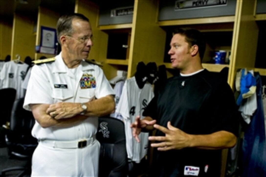 Navy Adm. Mike Mullen, chairman of the Joint Chiefs of Staff, visits with Chicago White Sox pitcher Jake Peavy in Chicago, Aug. 25, 2010. Mullen threw out the first pitch at U.S. Cellular Field before the White Sox played the Baltimore Orioles. Mullen is on a three-day Midwest tour to meet with local civic and business leaders to discuss the needs of returning troops, their families, and how community leaders can support them. He calls the tour "Conversations with the Country."







