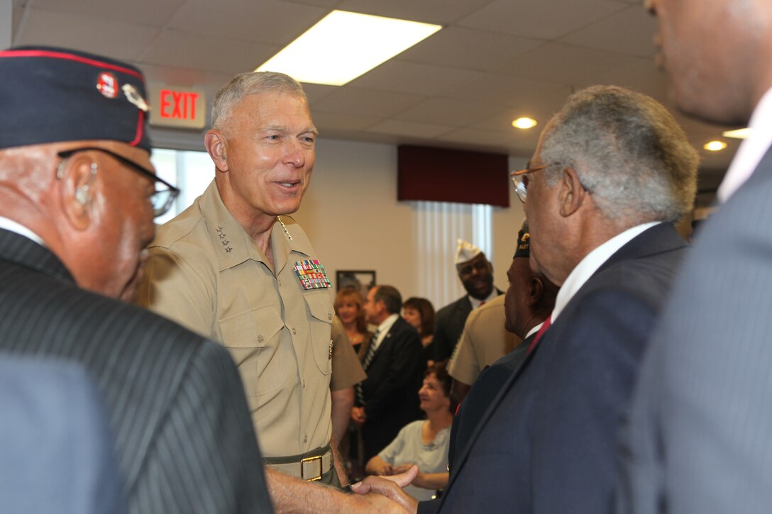 General James T. Conway, commandant of the Marine Corps, greets members of the Montford Point Marine Association, Inc., during a ceremony honoring African-American Marines who served in the Marine Corps in the 1940s aboard Montford Point Camp, now Camp Johnson, Aug. 26.  Senate Resolution 587 declared Aug. 26, 2010 as Montford Point Marine Day.