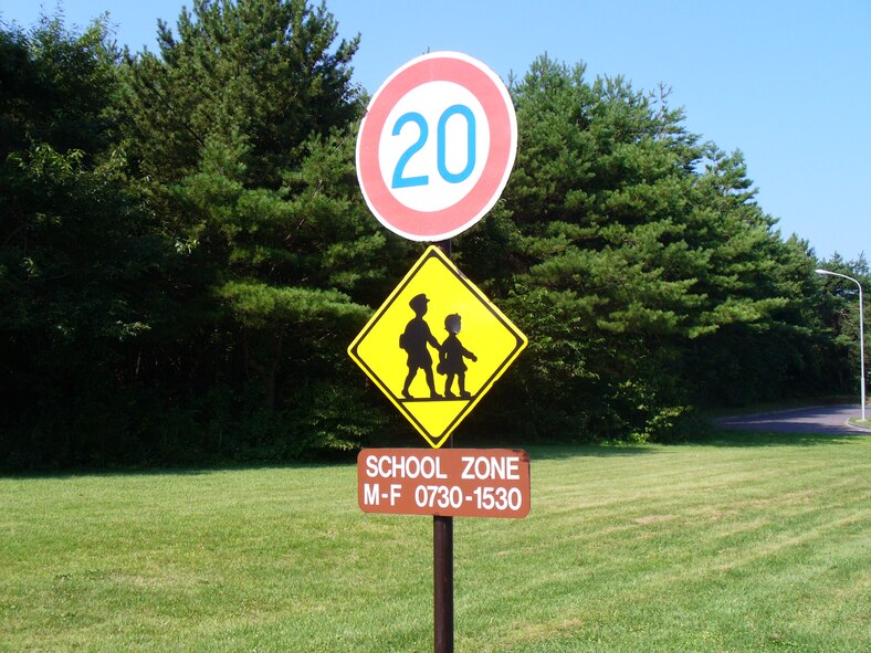 MISAWA AIR BASE, Japan -- A sign near Cummings Elementary School here warns motorists to slow down during the school day. Misawa officials remind motorists to pay attention to increased pedestrian traffic as the school year begins Aug. 30.  (U.S. Air Force Photo/Courtesy, 35th Fighter Wing Safety Office)
