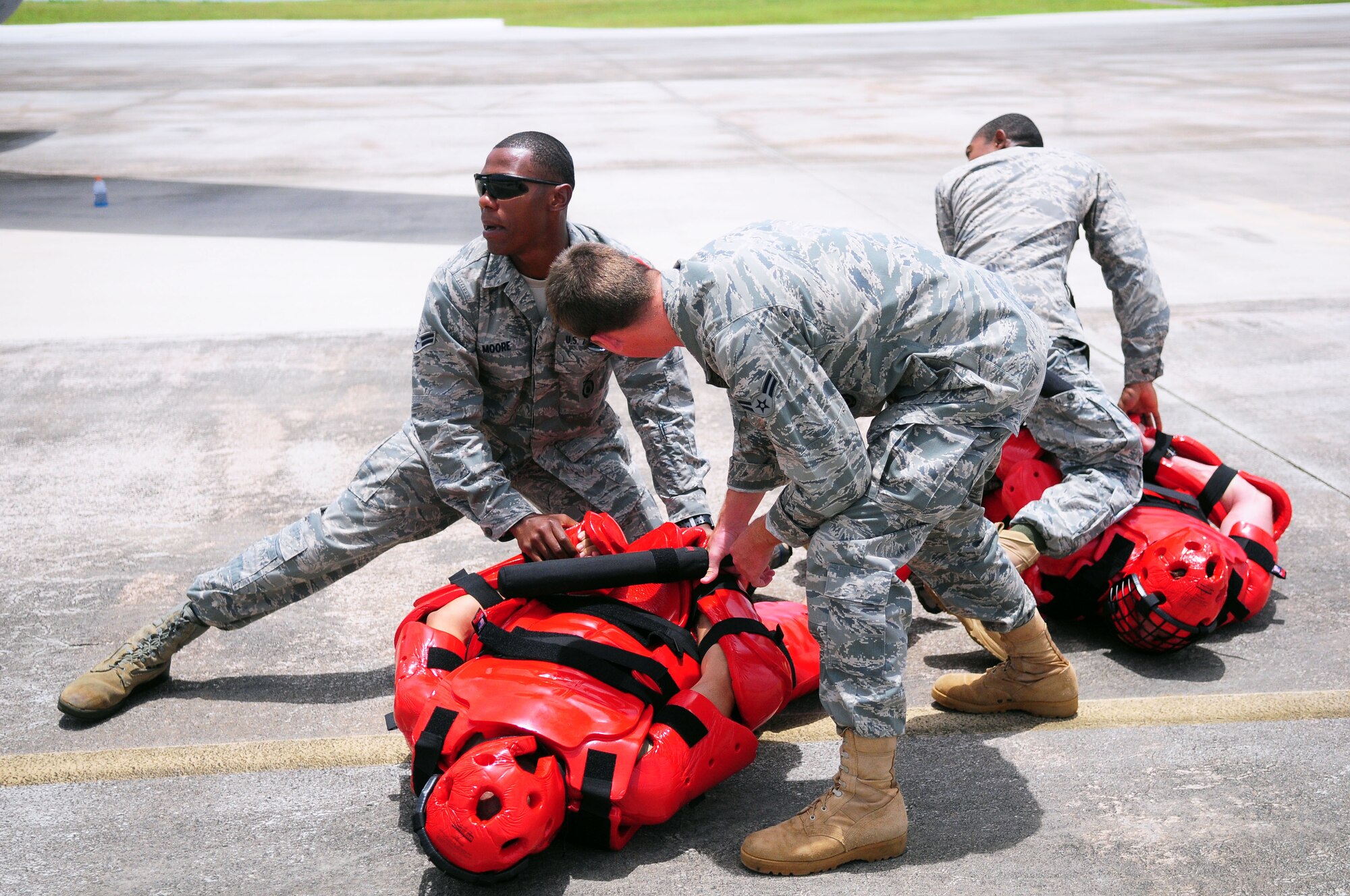 ANDERSEN AIR FORCE BASE, Guam ? 26 Airmen from the 736th Security Forces Squadron receive Fly-Away Training from a team of Pacific Air Forces instructors on the flightline, Aug. 6. The training teaches Airmen to judge every situation individually and react with an appropriate degree of force. (U.S. Air Force photo by Airman Julian North)