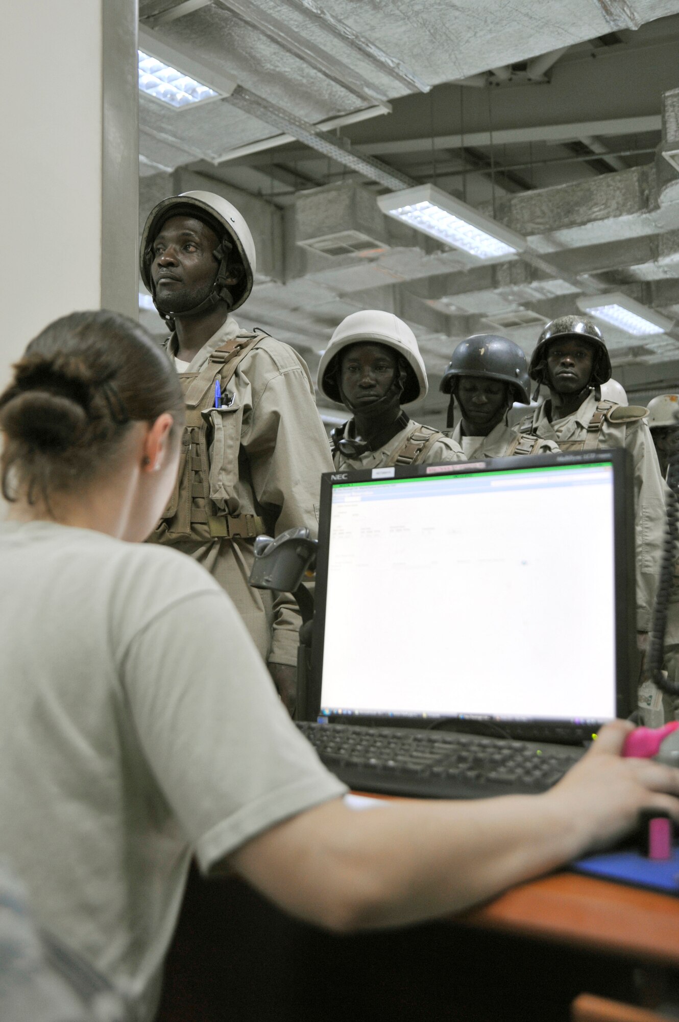 Senior Airman Cassandra Delisle ensures passengers are manifested on a flight Aug. 6, 2010, at Sather Air Base, Iraq. Airmen from the 447th Expeditionary logistics Readiness Squadron ensure normal people and cargo movements while simultaneously supporting the drawdown of forces in Iraq. Airman Delisle is a 447th Expeditionary logistics Readiness Squadron passenger service representative. (U.S. Air Force photo/Senior Airman Perry Aston)