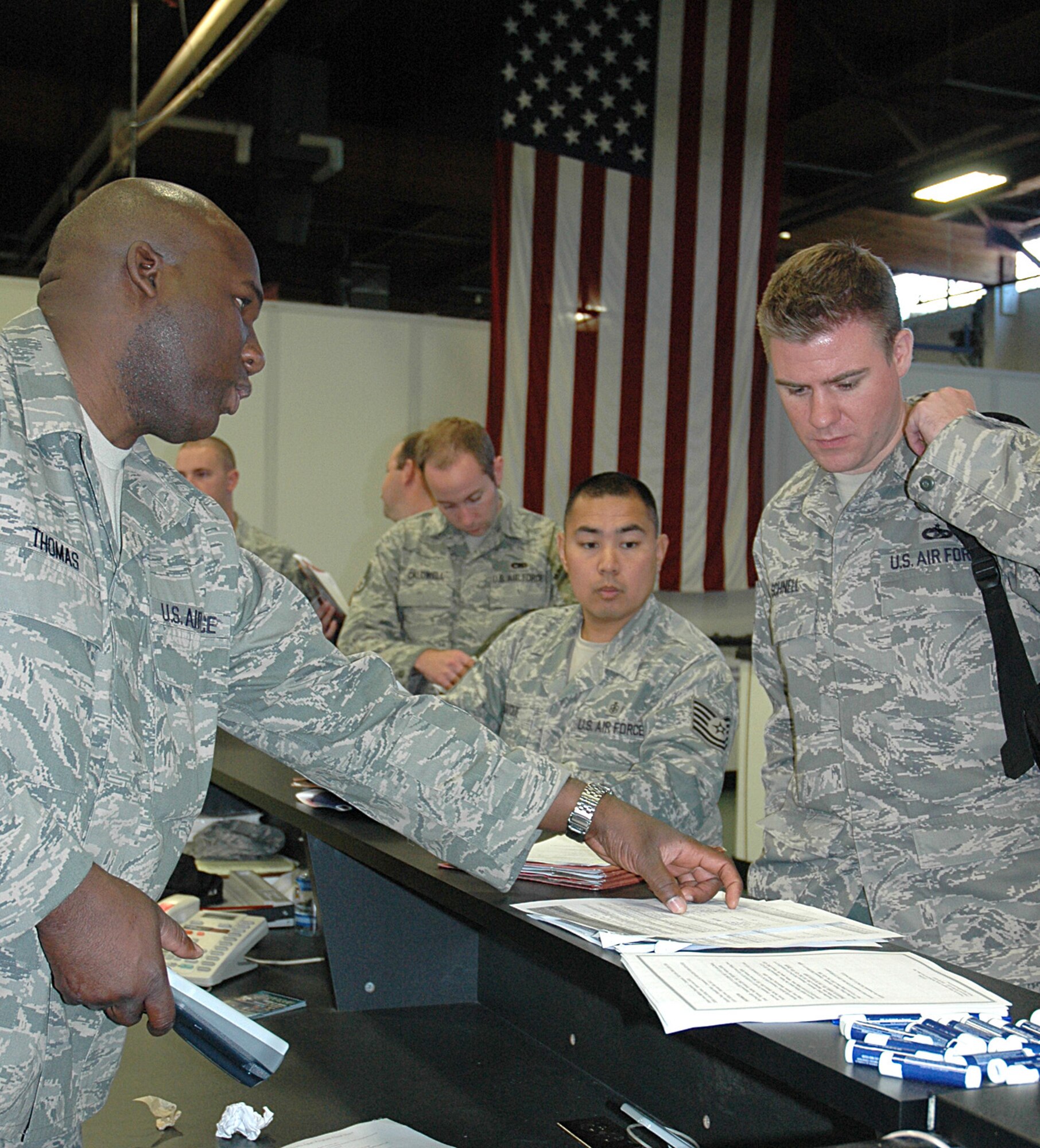 JOINT BASE LEWIS-MCCHORD, Wash., - Master Sgt. Steve Thomas, 446th Mission Support Squadron Airman and Family Readiness Center (left), explains the Hearts Apart program to Tech. Sgt. Kyle Schnell, 86th Aerial Port Squadron.  Sergeant Schnell is one of more than 60 Reservists from the 446th Airlift Wing deploying in the next two weeks to Southwest Asia. (U.S. Air Force photo/Sandra Pishner)