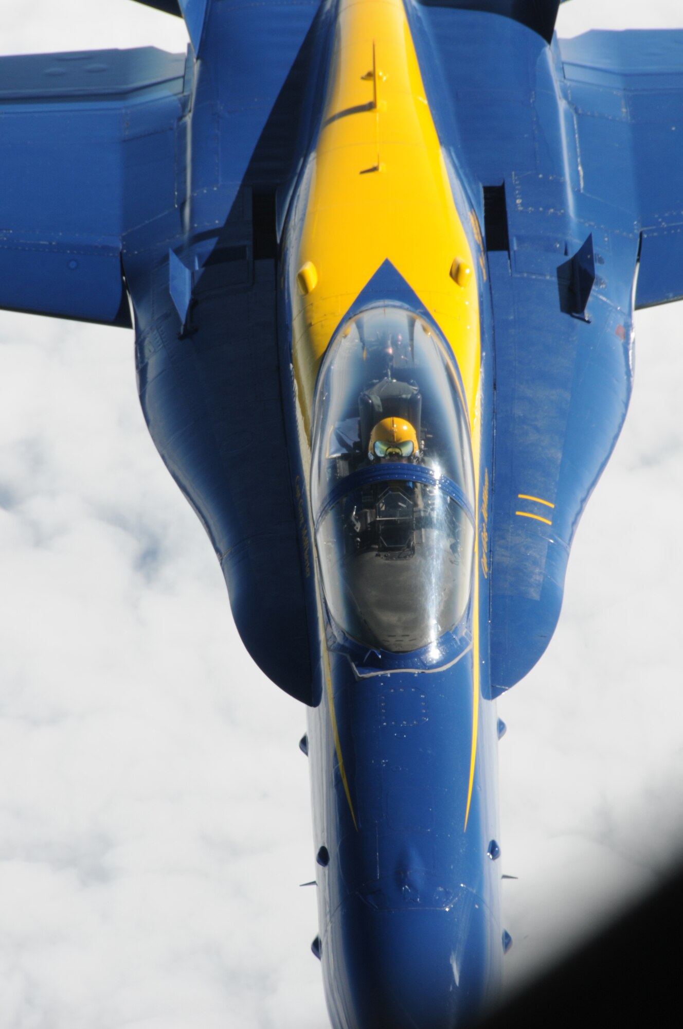 A close-up of  an F/A-18 Hornet belonging to the United States Navy's Flight Demonstration Squadron, the Blue Angels, during a refueling mission over the Eastern United States on August 25, 2010.  The tanker aircraft and crew are from the 157th Air Refueling Wing at Pease Air National Guard Guard Base, New Hampshire. The Blue Angels are headed to the 2010 Boston New-England Airshow at Pease International Airport on August 28th-29th 2010. Although the NH Air National Guard won't be hosting the airshow, they will be providing logistical support to the Blue Angels and other military aircraft. (U.S. Air Force photo/Staff Sgt. Curtis J. Lenz)
