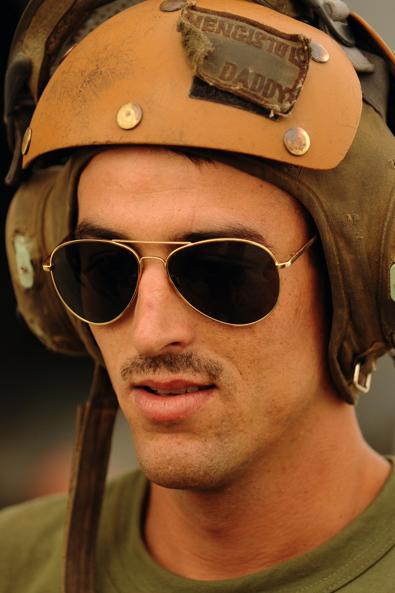 U.S. Marine Sgt. Leo Parry assigned to the 266th Medium Tilt Rotor Squadron, speaks with co-works during the a offload of a U.S. Marine Corps MH-53E Super Stallion off a C-17A Globemaster III aircraft, Aug. 26, 2010 at Camp Bastion, Afghanistan. The mission is in support of the Pakistan flood relief efforts. (U.S. Air Force photo/Staff Sgt. Manuel J. Martinez)