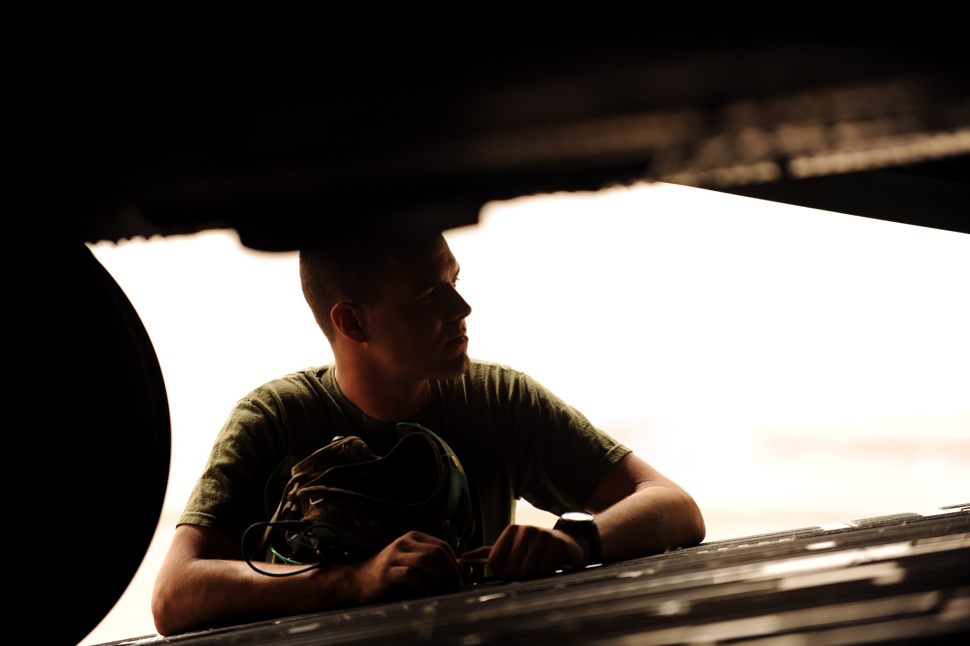 Lance Cpl. Russell Seese assigned to the 266th Medium Tilt Rotor Squadron spots  Aircrew assigned to the 10th and the 6th Airlift Squadron as they unload U.S. Marine Corps MH-53E Super Stallion out the ramp of a C-17A Globemaster III aircraft from Joint Base Lewis-McChord, Wash., Aug. 26, 2010 at Camp Bastion, Afghanistan. The mission is in support of the Pakistan flood relief efforts. (U.S. Air Force photo/Staff Sgt. Manuel J. Martinez)