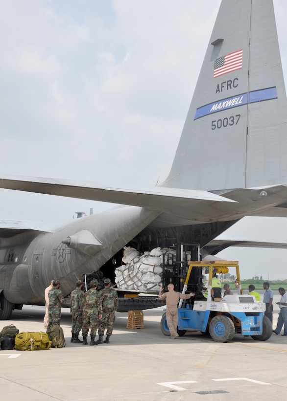 A loadmaster guides a forklift carrying international aid destined for Pakistani flood victims onto a C-130 Hercules cargo aircraft at Pakistan Air Force Base Chaklala, Pakistan. To date, U.S. military cargo aircraft based in Afghanistan have transported more than 194,000 pounds of relief supplies from the Pakistan air force's central flood relief cell to required locations throughout Pakistan in support of government of Pakistan officials' requests for additional airlift support. In addition, U.S. military helicopter crewmembers conducting relief operations in partnership with the Pakistan military have rescued more than 4,800 people and transported more than 600,000 pounds of relief supplies. (Courtesy photo)