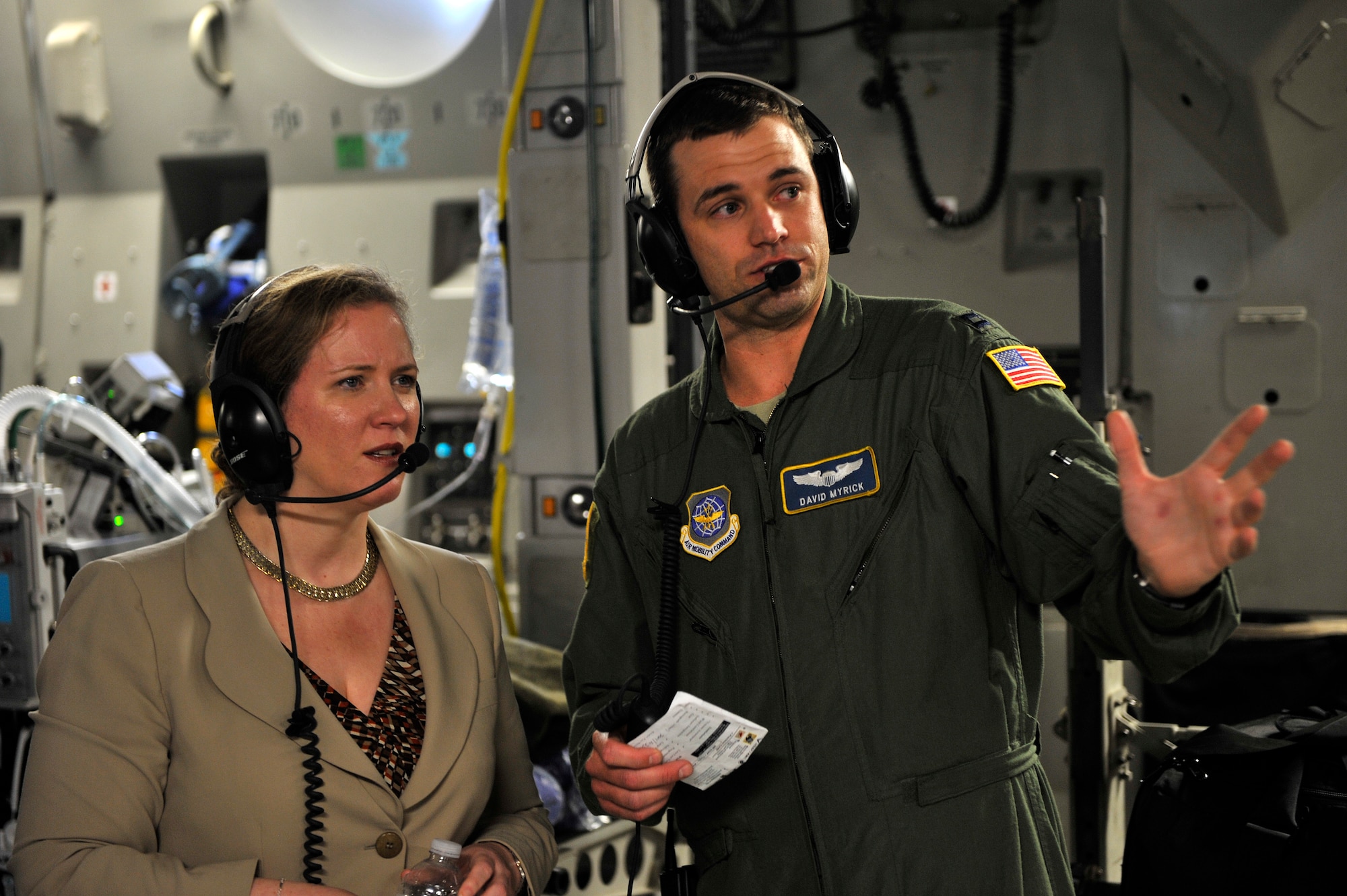 Under Secretary of the Air Force Ms. Erin C. Conaton speaks with Capt. David Myrick, from the 14th Airlift Squadron, on board a C-17 Globemaster III aircraft from Joint Base Charleston, S.C., over Virginia, on Aug. 19, 2010.  Ms. Conaton was given several demonstrations on the capabilities of the C-17 during her flight such as precision air drop and aeromedical evacuation.  (U.S. Air Force Photo/Staff Sgt. Michael B. Keller)
