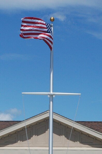 Members of Naval Mobile Construction Battalion 27 officially raised the flag above their new home at Westover Air Reserve Base on Aug. 6, 2010. More than 450 Sailors from throughout the New England region are stationed with the combat construction unit. (Air Force Photo/Timm Huffman)