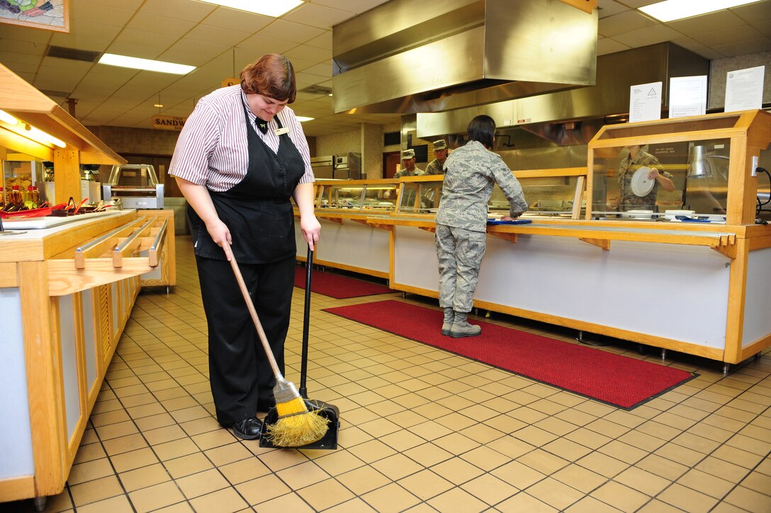 ELLSWORTH AIR FORCE BASE, S.D. –Tonya Denke, 28th Force Support Squadron Bandit Inn mess attendant, sweeps the Bandit Inn Dining Facility, Aug. 20. Disabled civilians and Airmen work together at the Bandit Inn to serve approximately 600 Airmen a day. (U.S. Air Force photo/Senior Airman Corey Hook) 