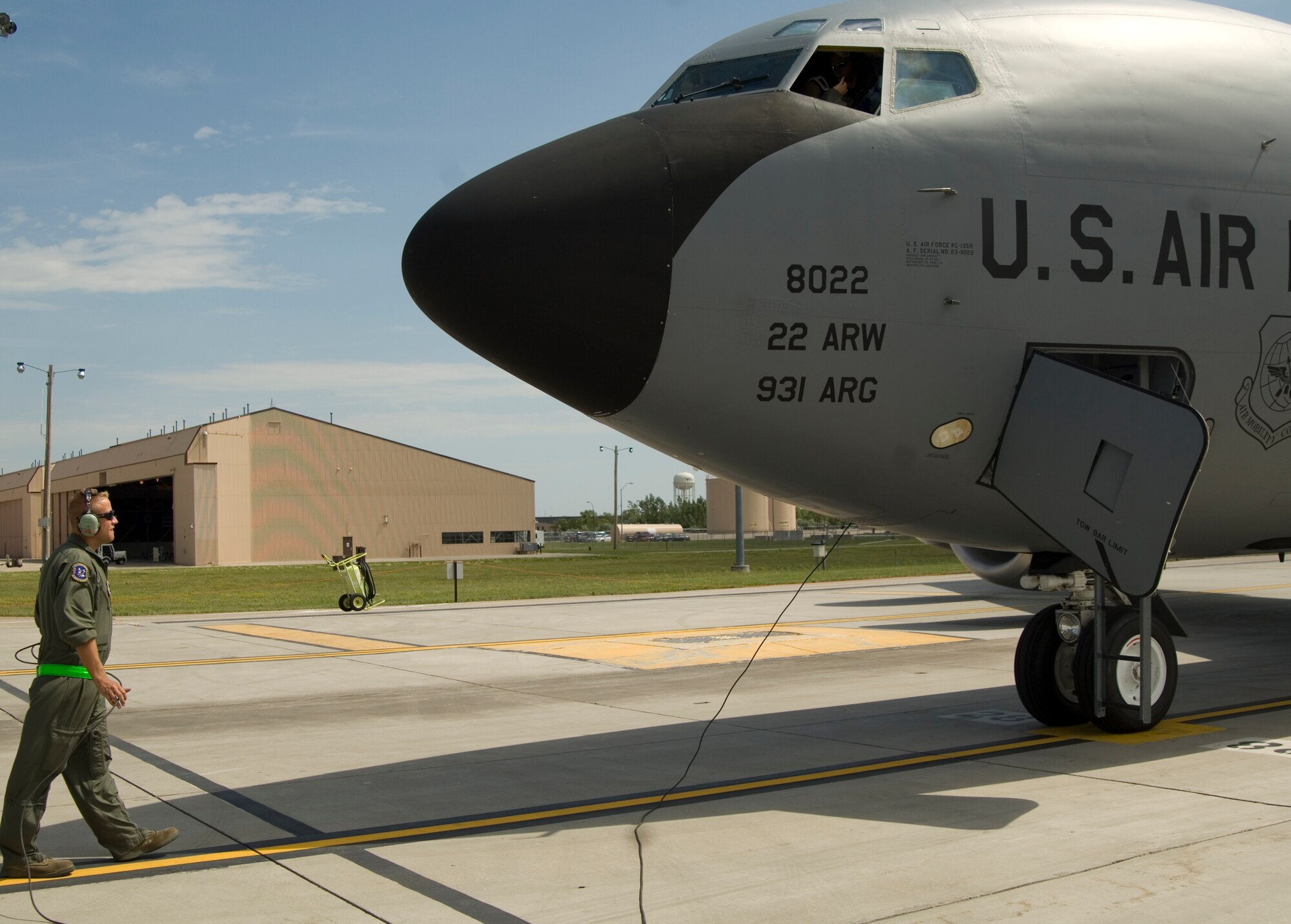 Staff Sgt. Nick Shurtz, 22nd Aircraft Maintenance Squadron flight crew chief, prepares one of McConnell’s 63 KC-135 Stratotankers for takeoff during an operational readiness exercise Aug. 17, 2010, Grand Forks Air Force Base, N.D.  This KC-135, recently broke a record by maintaining a zero discrepancy report for more than a week.  (U.S. Air Force photo/Senior Airman Abigail Klein)