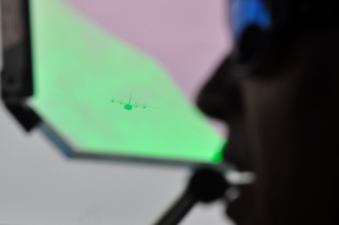 The view through the heads up display on the C-130J-30 “Super Hercules” of another aircraft of the same model during a training mission conducted Aug. 19 over Camp Shelby, Hattiesburg, Miss. During the mission, combat maneuvering was executed, in addition to dropping two training pallets.  (U. S. Air Force photo/Master Sgt. Daniel Nathaniel)