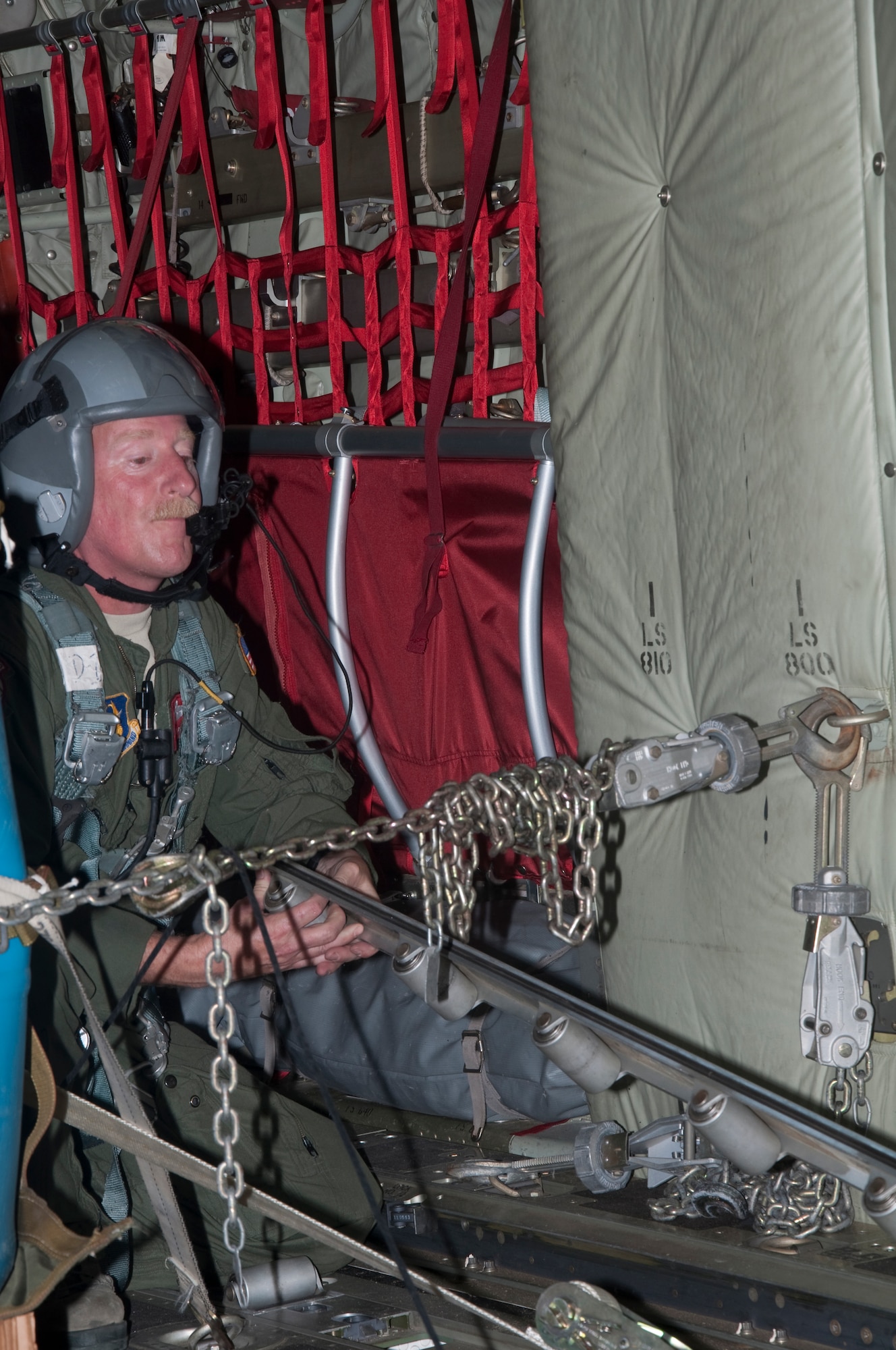 Tech. Sgt. David Pirie, 815th Airlift Squadron loadmaster, prepares the cargo bay for an air drop Aug. 19 over Camp Shelby, Hattiesburg, Miss. During the mission, combat maneuvering of the C-130J-30 “Super Hercules” was executed, in addition to dropping two training pallets.  (U. S. Air Force photo/Master Sgt. Daniel Nathaniel)