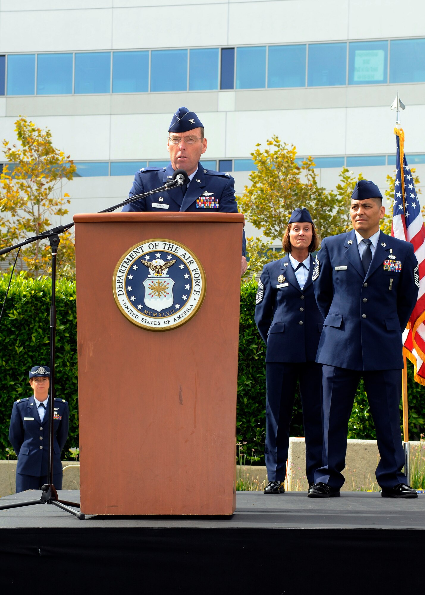 Col. Frank Simcox speaks at his assumption of command of the 61st Air Base Group, July 30.  (Photo by Jim Gordon)