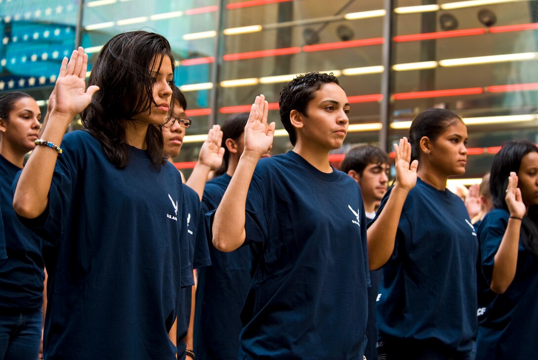 Newly sworn-in recruits are acknowledged by the public for their commitment to serve in the Air Force during Air Force Week New York Aug. 26, 2010, in New York's Times Square. The week serves as the premier platform to share the Air Force story with fellow citizens, and will include community visits and talks by Air Force officials, flight demonstrations, and displays providing an up close and personal look at the men and women of the Air Force serving worldwide in defense of freedom. (U.S. Air Force photo/Tech. Sgt. Bennie J. Davis III)