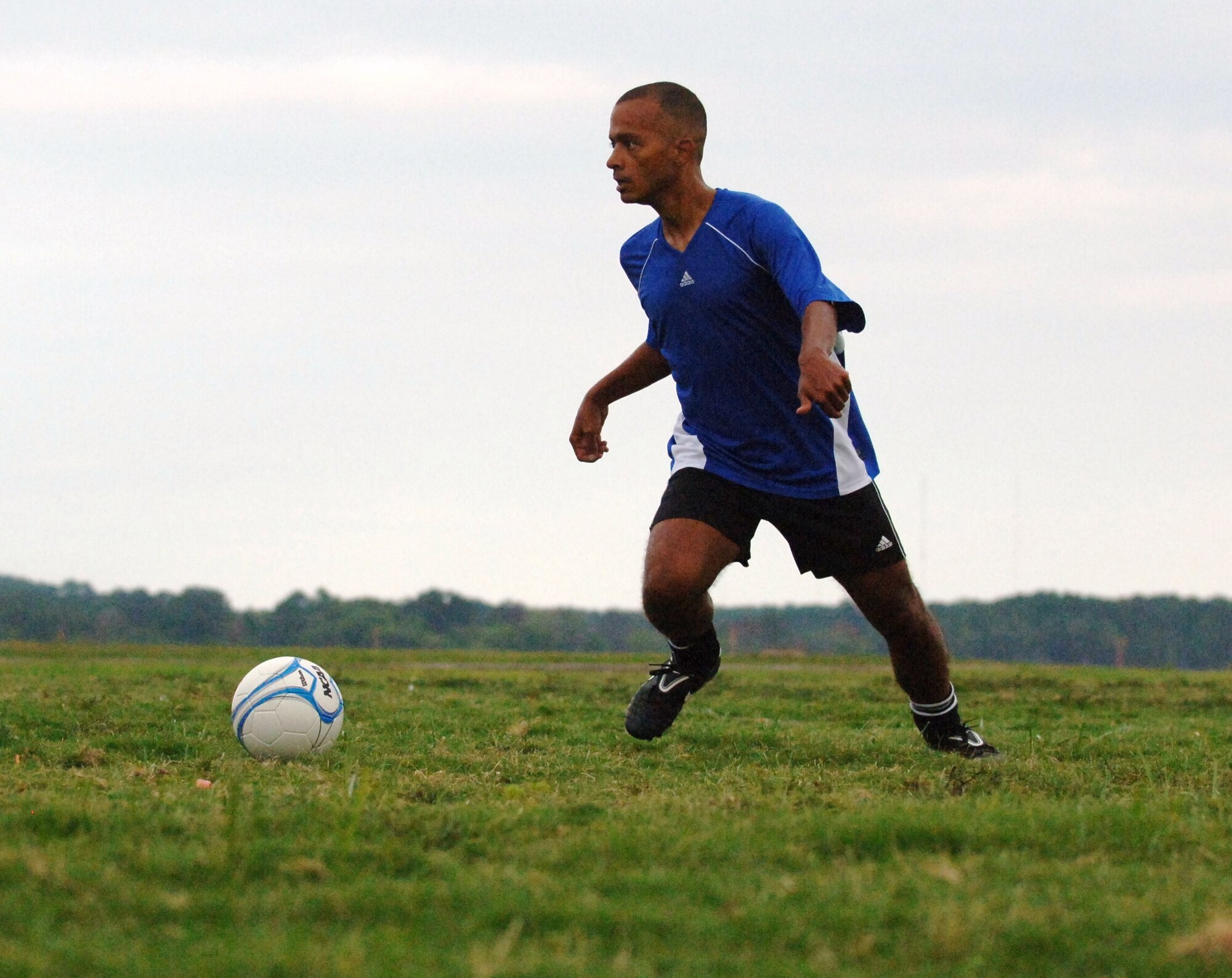 LANGLEY AIR FORCE BASE, Va. -- Dennison Frasier, a civilian contractor for the Air Force Public Affairs Agency and Langley men’s varsity soccer team organizer, prepares to attempt a shot during practice at the Langley athletic fields Aug. 25. Frasier will join 18 teammates on a trip to Texas Sept. 2 to participate in the Defender's Cup, a nationwide invitational military tournament over the Labor Day weekend, hosted by Joint Base San Antonio. (U.S. Air Force photo/Airman 1st Class Jason J. Brown)