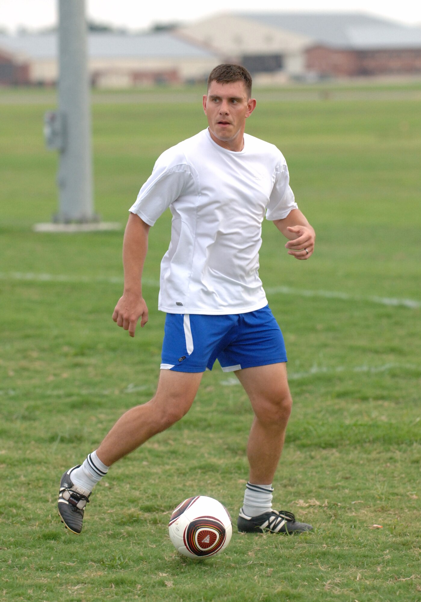 LANGLEY AIR FORCE BASE, Va. -- Senior Airman Thomas Edwards, 633d Medical Support Squadron, looks downfield during practice at the Langley athletic fields Aug. 25. Airman Edwards will join 18 teammates on a trip to Texas Sept. 2 to participate in the Defender's Cup, a nationwide invitational military tournament over the Labor Day weekend, hosted by Joint Base San Antonio. (U.S. Air Force photo/Airman 1st Class Jason J. Brown)
