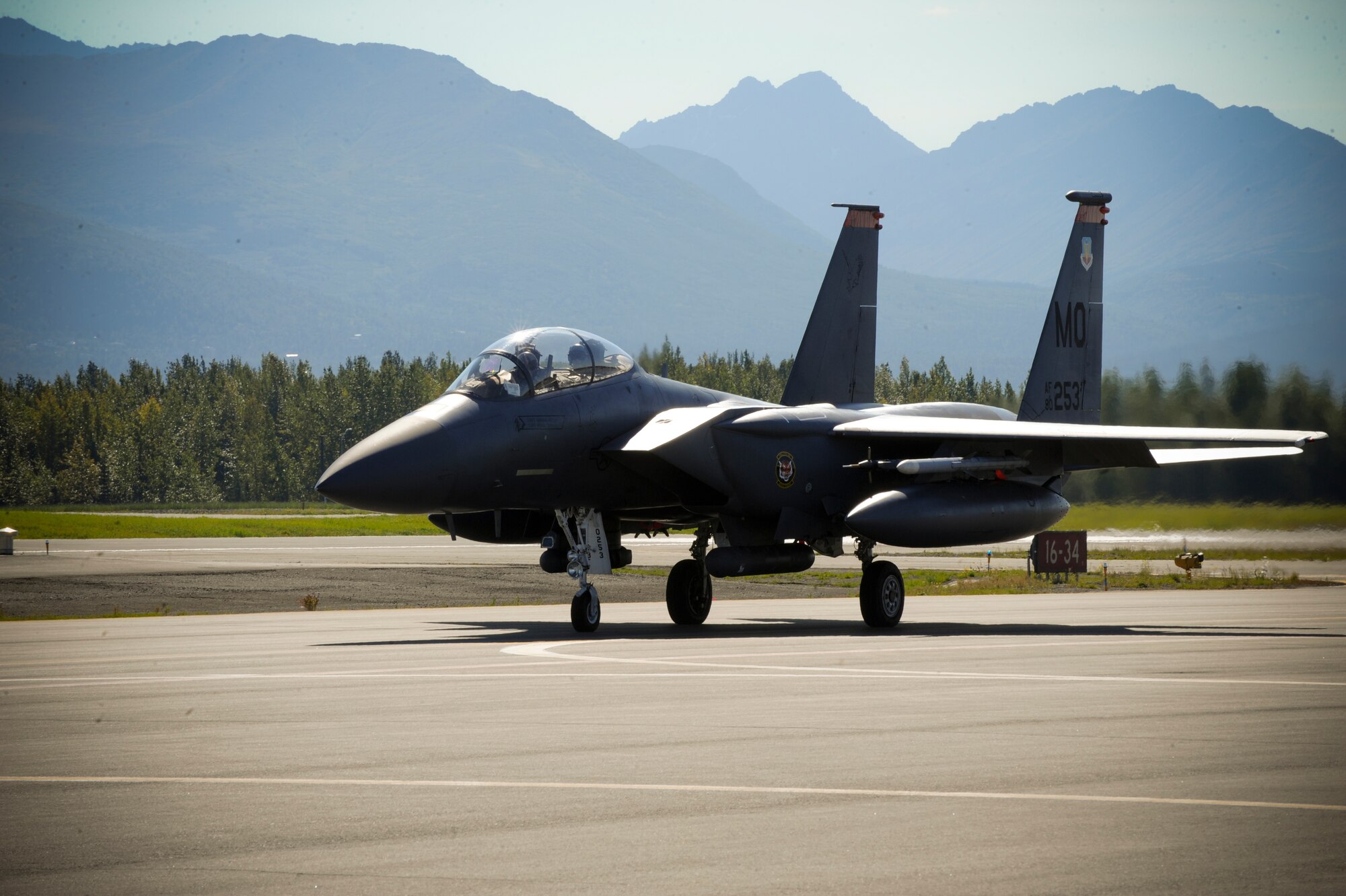 JOINT BASE ELMENDORF-RICHARDSON, Alaska -- An F-15E Strike Eagle, from the 391st Fighter Squadron out of Mountain Home Air Force Base, Idaho, taxies the runway here Aug. 25. The 391st FS is currently assigned to Joint Base Elmendorf-Richardson for a temporary duty assignment to aid in training exercises for the F-22 Raptor Squadrons stationed here. (U.S. Air Force Photo by Staff Sgt. Joshua Garcia)