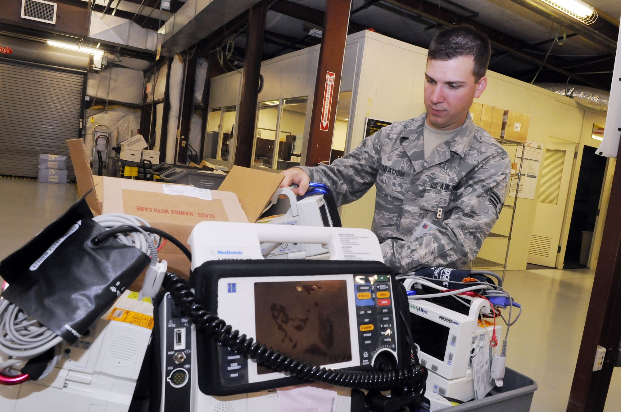 SrA Jason Stobaugh, BioMedical equipment technician,prepares medical equipment for deployable packages. U. S. Air Force photo by Sue Sapp