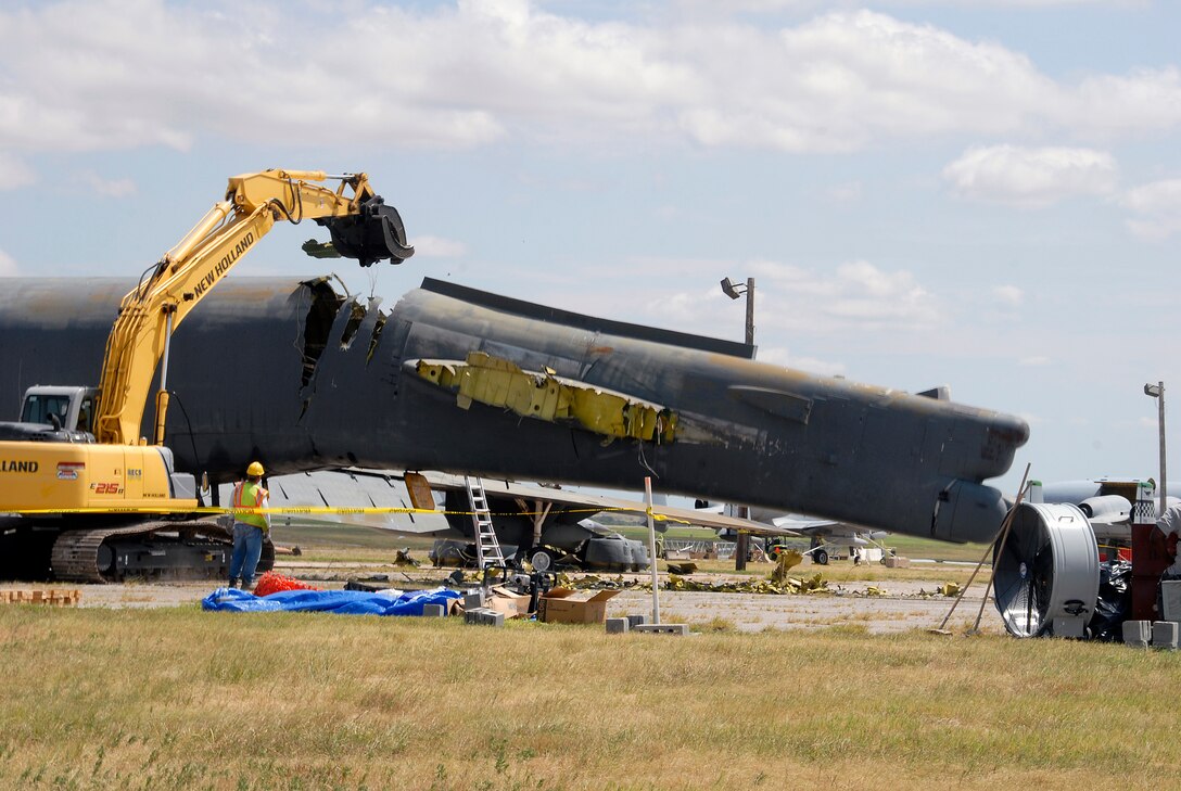 The tail section of a B-52G Stratofortress begins to bend Aug. 25 as crews work to demolish the former aircraft maintenance trainer. The 982nd Training Group determined the aircraft was an "excess" piece of equipment when Sheppard Air Force Base received an updated model, the B-52H. (U.S. Air Force photo/Mike Litteken)