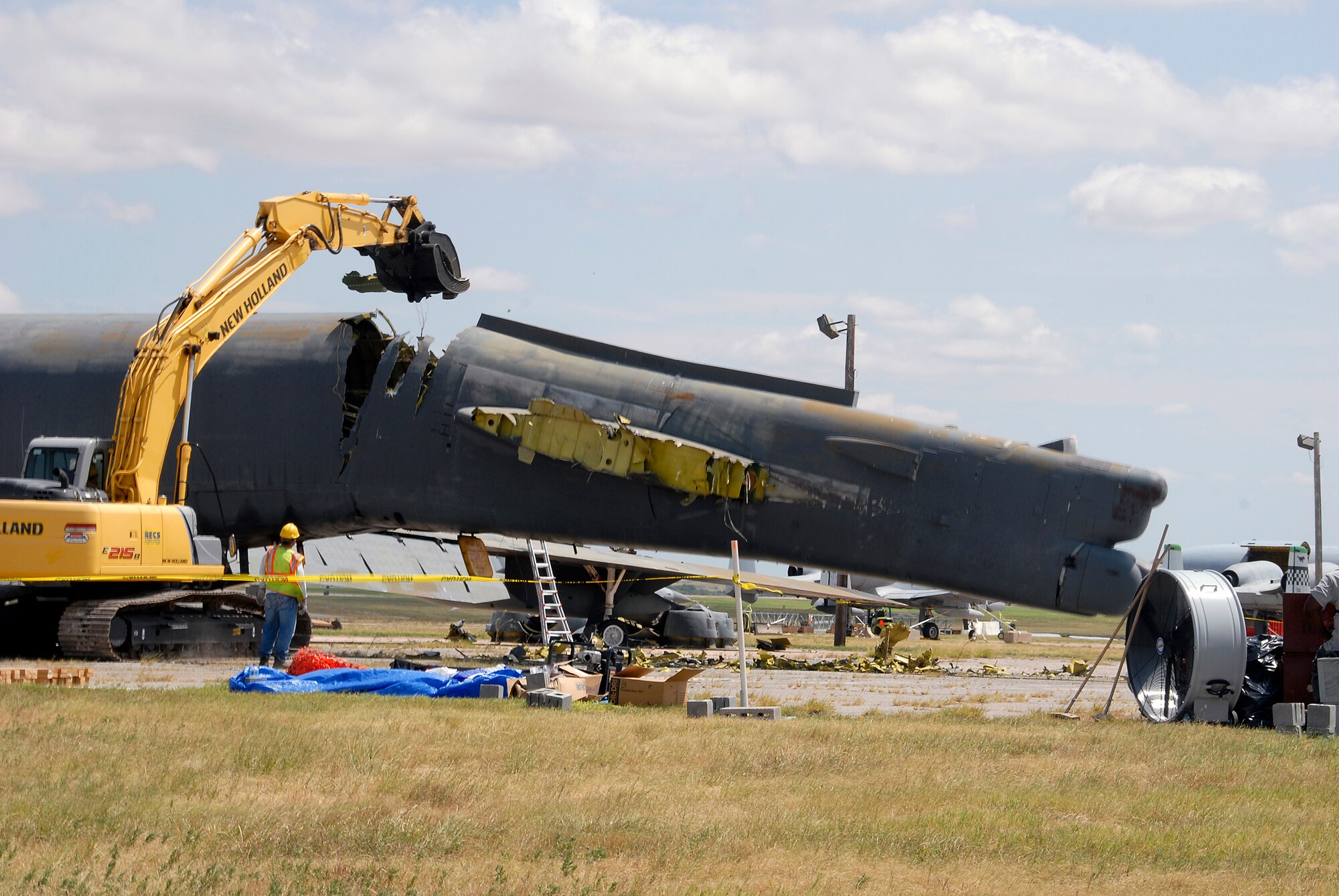 The tail section of a B-52G Stratofortress begins to bend Aug. 25 as crews work to demolish the former aircraft maintenance trainer. The 982nd Training Group determined the aircraft was an "excess" piece of equipment when Sheppard Air Force Base received an updated model, the B-52H. (U.S. Air Force photo/Mike Litteken)