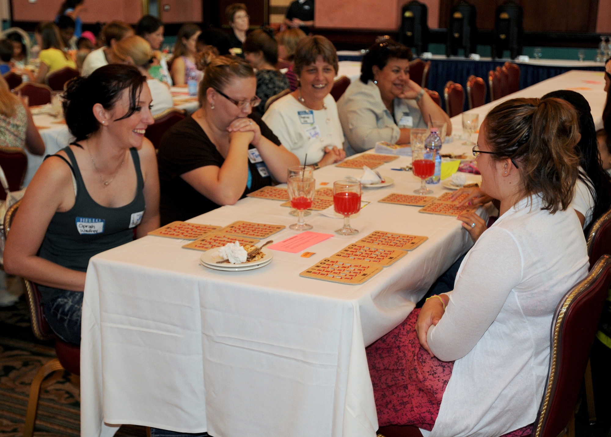 Aviano spouses play bingo and converse Aug. 24 during "Spouse It Up" at La Bella Vista Club.  The quarterly event is sponsored by the 31st Fighter Wing and encourages spouses to establish a support.  (U.S. Air Force photo/Senior Airman Tabitha M. Lee)