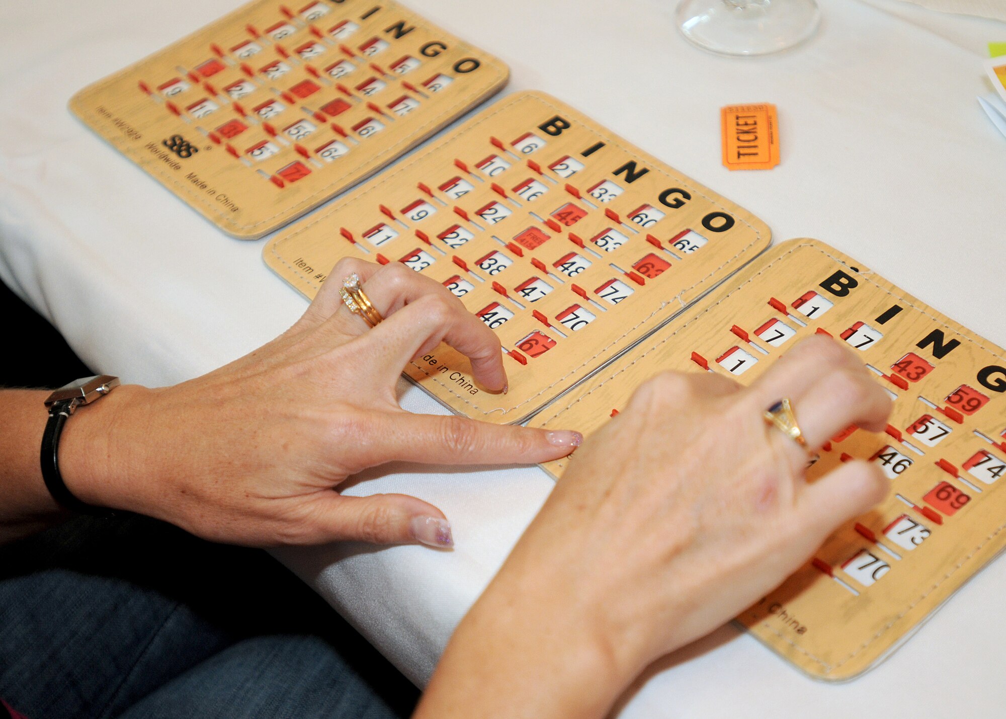 An Aviano spouse plays bingo Aug. 24 during "Spouse It Up" at La Bella Vista Club.  The "Spouse It Up" program encourages spouses to have a well established support system so they can adjust to change.  (U.S. Air Force photo/Senior Airman Tabitha M. Lee)
