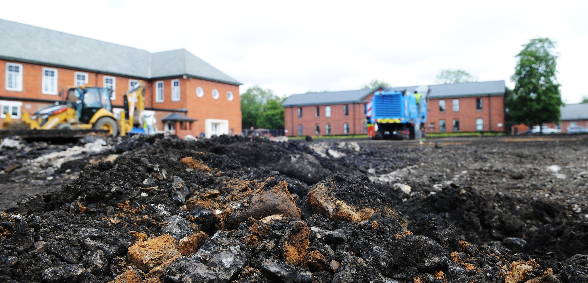 RAF MILDENHALL, England -- Contractors remove about 170 millimeters of concrete in Washington Square here. The square is transforming from a parking lot into a pedestrian-friendly green space. (U.S. Air Force photo/Staff Sgt. Thomas Trower) 