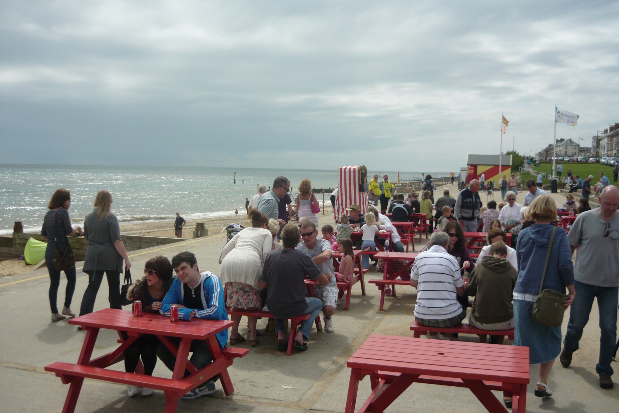 Holidaymakers enjoy the promenade at Southwold, England. The traditional red-and-white striped  booth of a children's Punch and Judy show is visible in the middle ground. (U.S.Air Force photo by Senior Airman David Dobrydney)