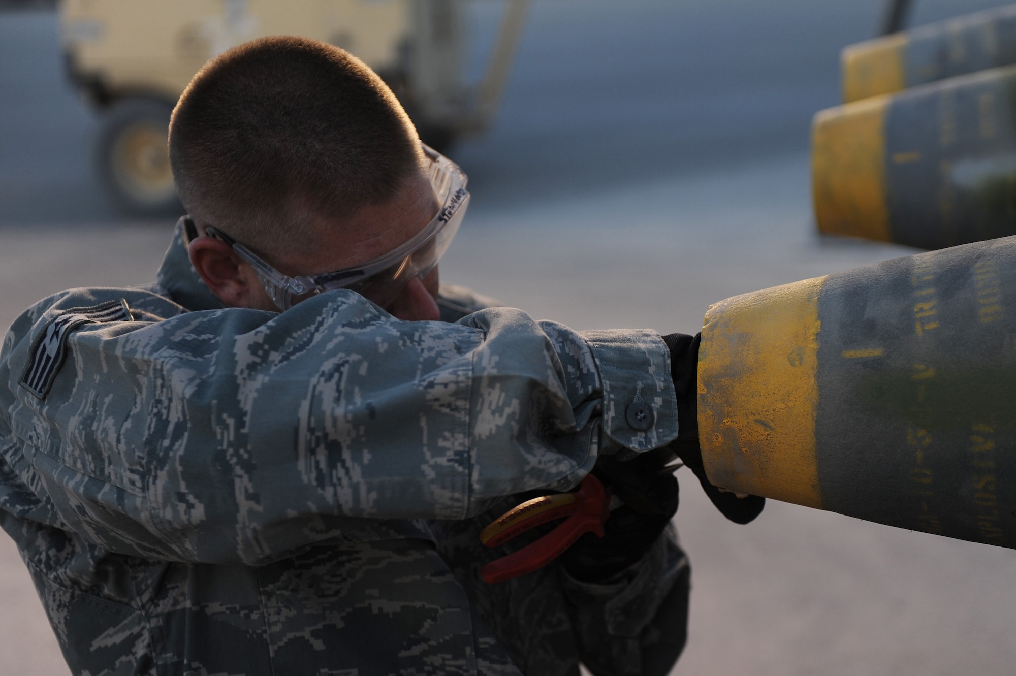 Staff Sgt. Jeremiah Smartt positions a fuse inside a bomb while Aug. 23 at Kandahar Airfield, Afghanistan. Sergeant Smartt is a conventional maintenance crew chief with the 451st Expeditionary Maintenance Squadron Munitions Flight. (U.S. Air Force photo by Tech. Sgt. Chad Chisholm/Released)