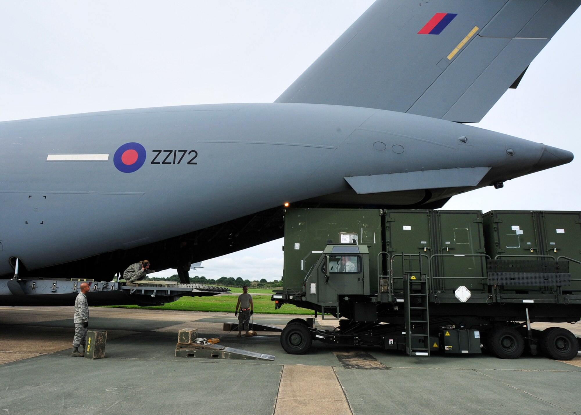 Containers are loaded into a Royal Air Force C-17 Globemaster at RAF Lakenheath, England, Aug. 25. The RAF provided the C-17 to assist the 48th Fighter Wing shuttle equipment to Iceland in support of Icelandic Air Policing. With the help of the RAF, the Liberty Wing was able to save $2.2 million. (U.S. Air Force photo/Airman 1st Class Tiffany Deuel)