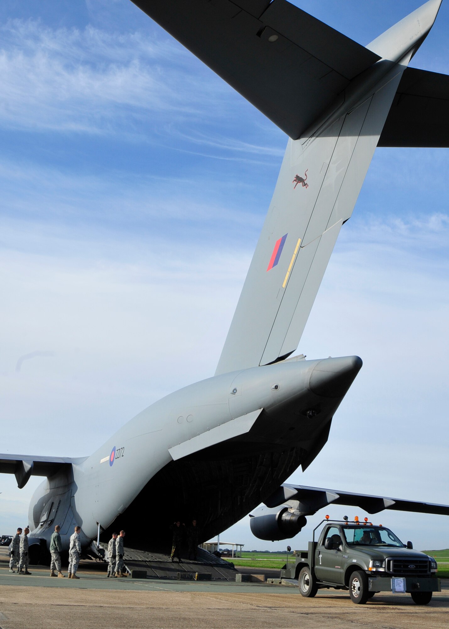 A truck is loaded onto a Royal Air Force C-17 Globemaster at RAF Lakenheath, England, Aug. 25. The C-17 was provided by RAF Brize Norton to assist the 48th Fighter Wing shuttle equipment to Iceland in support of the Icelandic Air Policing operation. By utilizing RAF aircraft, the Liberty Wing saved $2.2 million.  (U.S. Air Force photo/Airman 1st Class Tiffany Deuel)