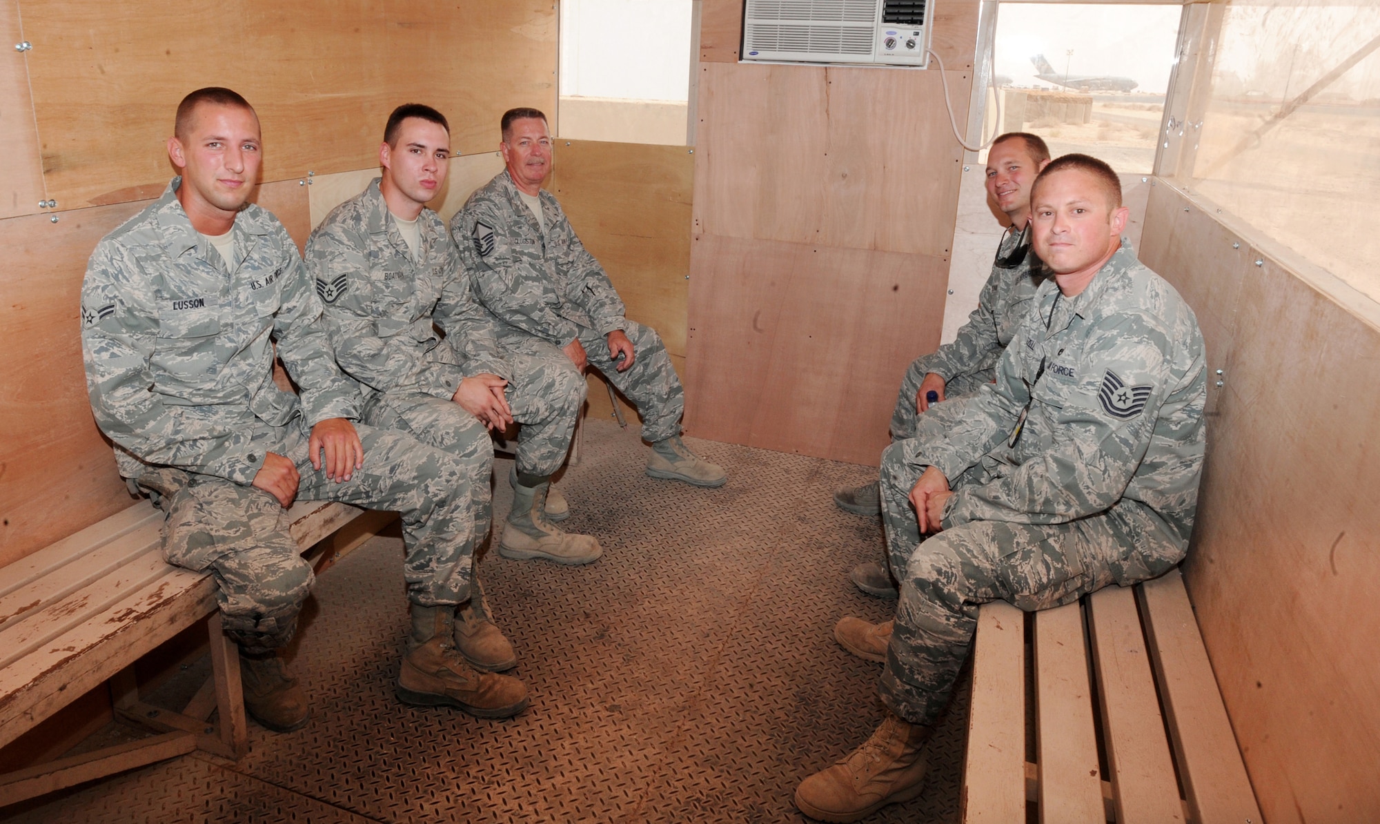 SOUTHWEST ASIA -- Aircraft maintainers take a break here Aug. 8, 2010, in a flightline cooling shed built by the 386th Expeditionary Civil Engineer Squadron. Maintenance troops work long hours in extreme heat, with ambient flightline temperatures topping 140 degrees Fahrenheit. (U.S. Air Force photo by Senior Airman Laura Turner)