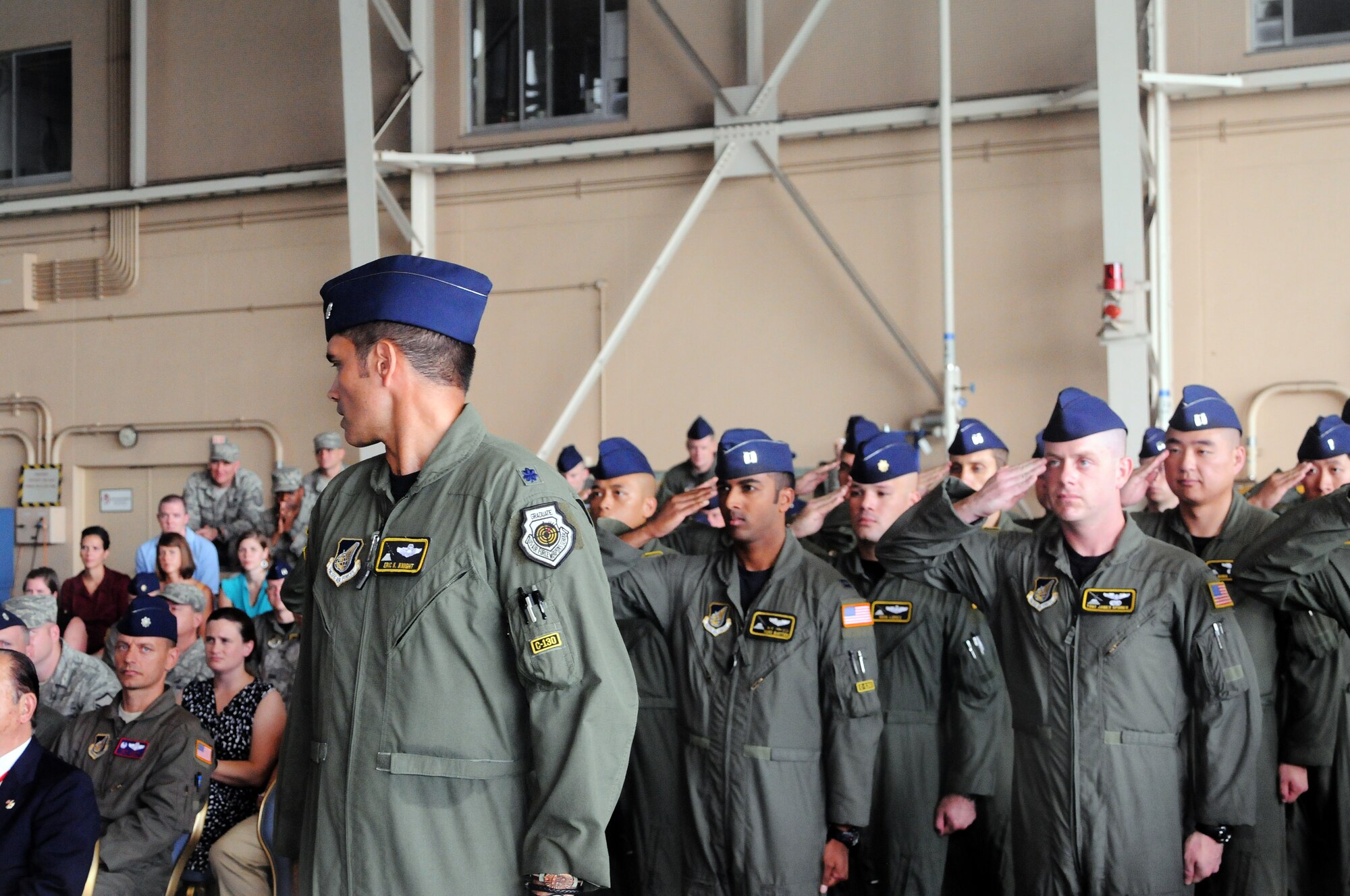 YOKOTA AIR BASE, Japan -- The Commander of Troops, Lt. Col. Eric Knight, gives the order to "present arms" so that the 36 AS Eagle Airlifters can present their final salute to outgoing commander, Lt. Col. David Kincaid. (U.S. Air Force photo/Airman 1st Class Katrina R. Menchaca)