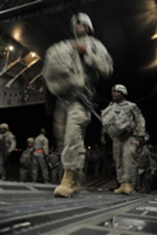 U.S. Army soldiers board a C-17 Globemaster III aircraft at Sather Air Base, Iraq, on Aug. 13, 2010.  The soldiers redeployed as part of the drawdown of U.S. forces from Iraq.  More than 90,000 troops have already been redeployed.  